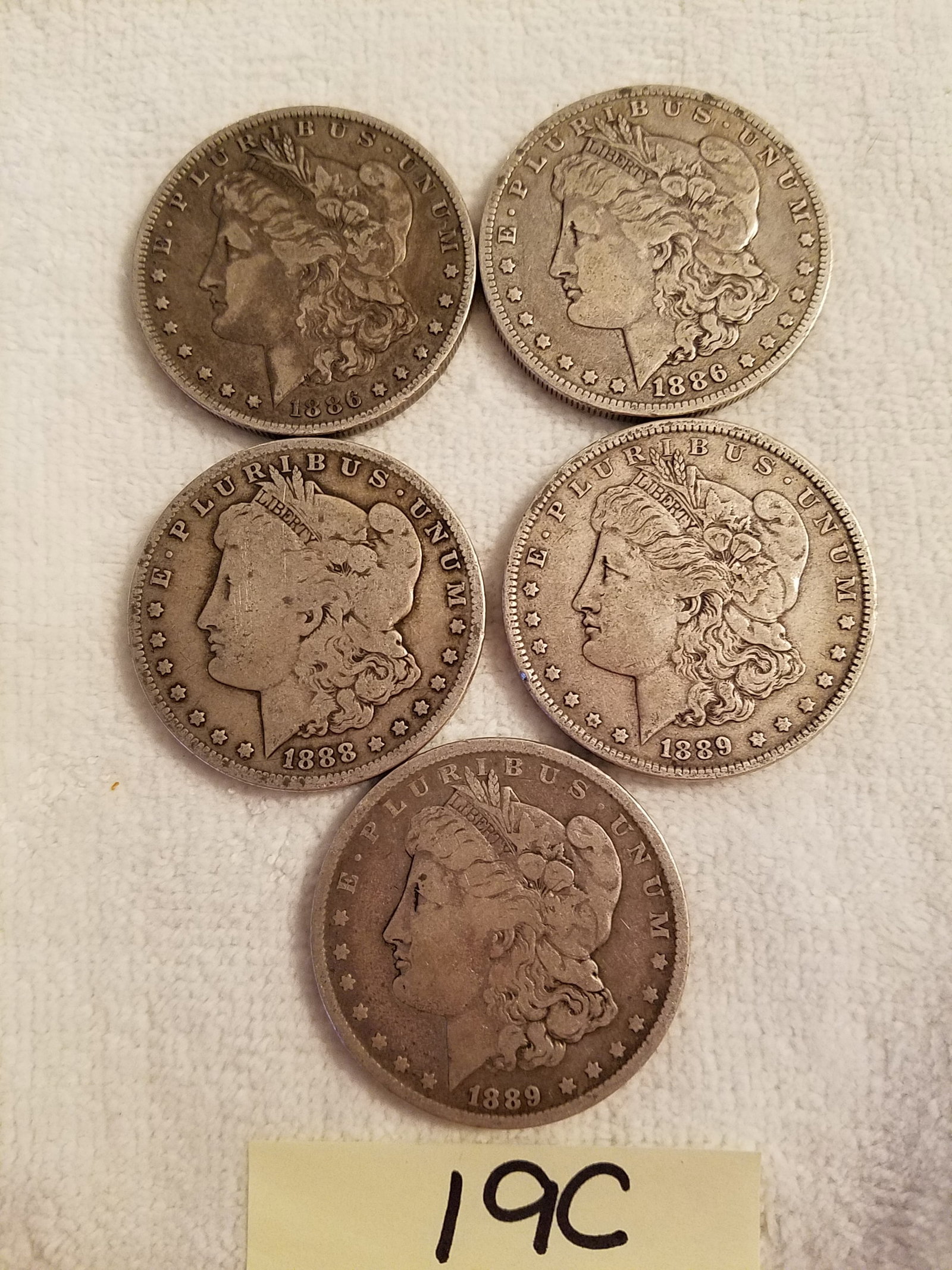 Five US Morgan Silver Dollars: Five US Morgan silver dollars. 1886-O, 1886-O, 1888-O, 1889 and 1890-O. 90% silver. See photos.