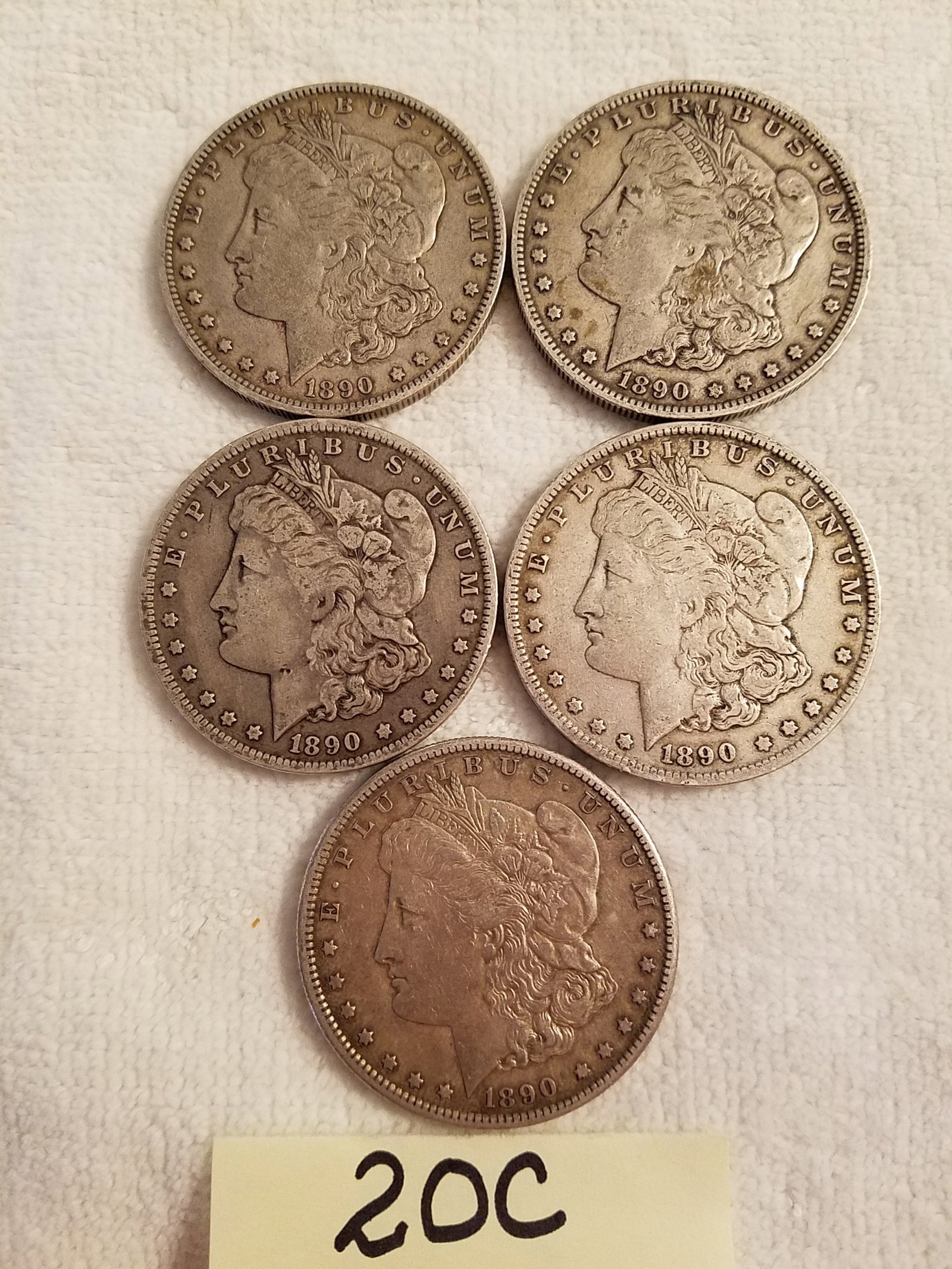 Five US Morgan Silver Dollars: Five US Morgan silver dollars. 1890-O, 1890-O, 1890-O, 1890-O and 1890-S. 90% silver. See photos.