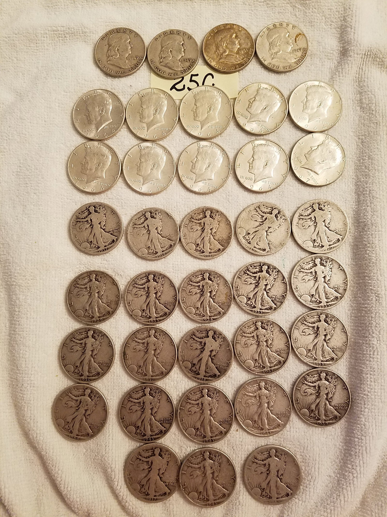 Large Lot of US Silver Half Dollars: Large lot of US silver half dollars. 23 Walking Liberty, 10 Kennedy and 4 Franklin. 90% silver. See photos.
