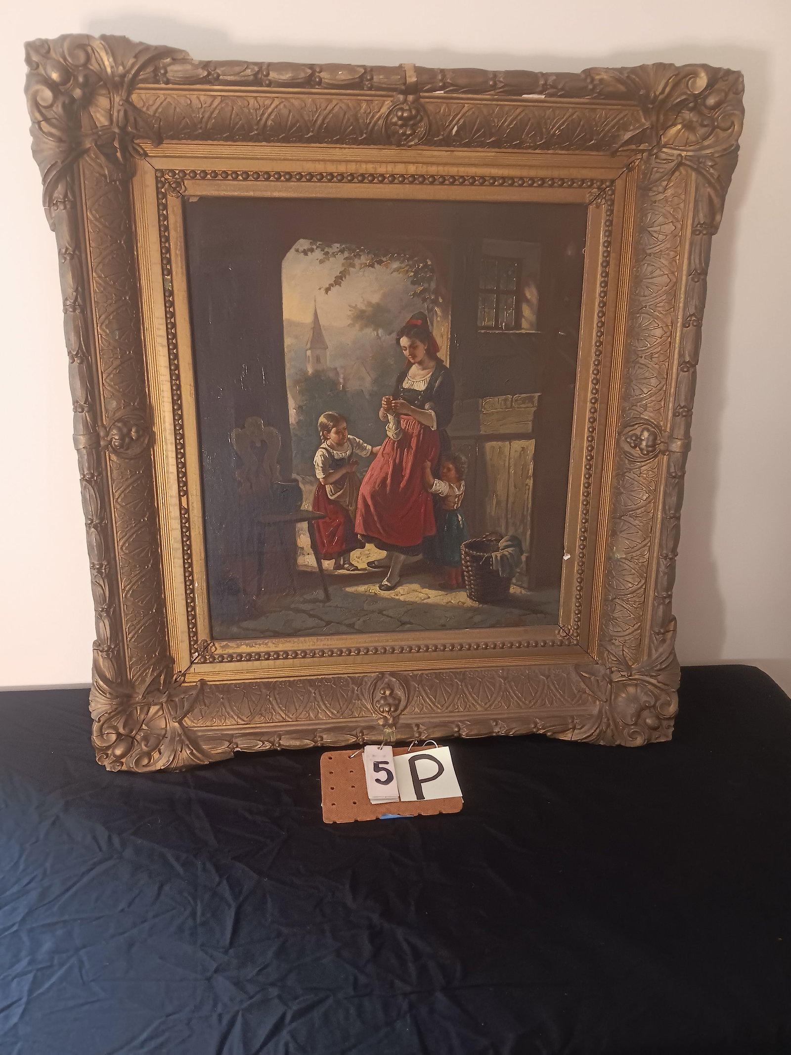 Oil on Canvas Painting Signed by Emil Rau: Oil on canvas painting of a young woman sewing with two children, signed by Emil Rau. Frame is 29.75"w x 32.5"h. Painting is 18.75"w x 21.625"h. Minor damage to frame. See photos. From the Dr. Thomas 