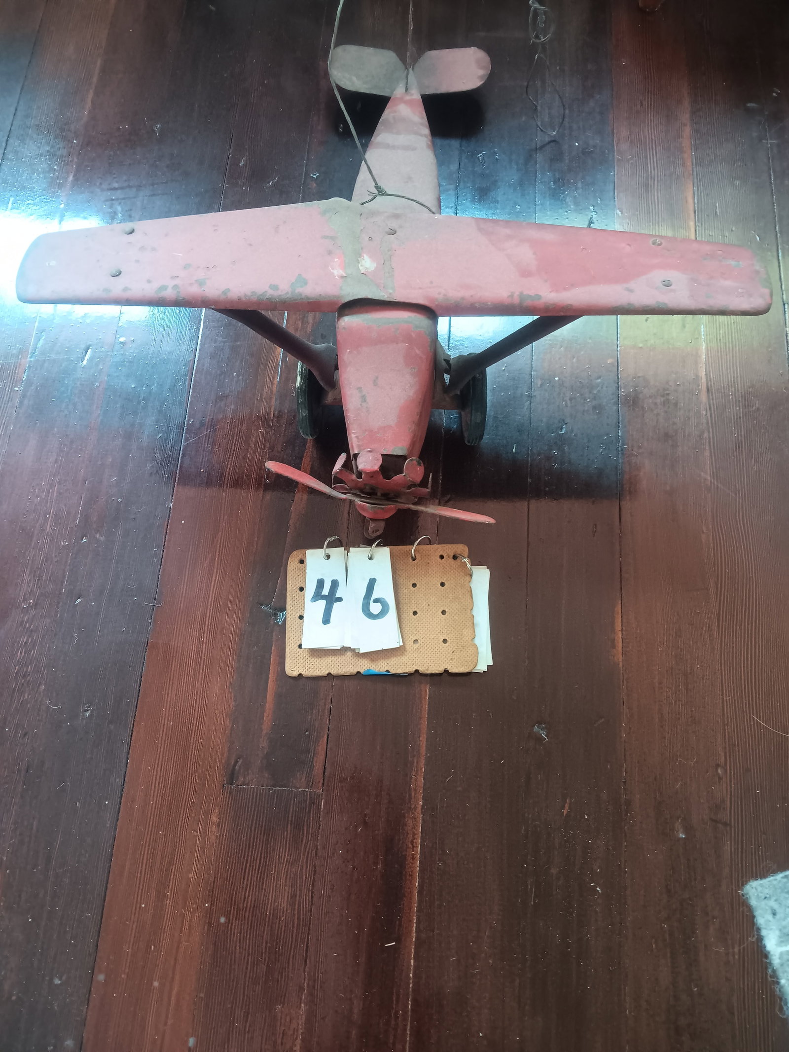 1900s American Metal Airplane Toy: 1900s American metal airplane toy with rubber wheels. Repainted and dented. 24.5"l x 22.5"w x 8"h. See photos. From the Dr. Thomas Fallon Collection.