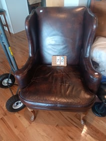Two Nonmatching Leather Wingbacked Chairs