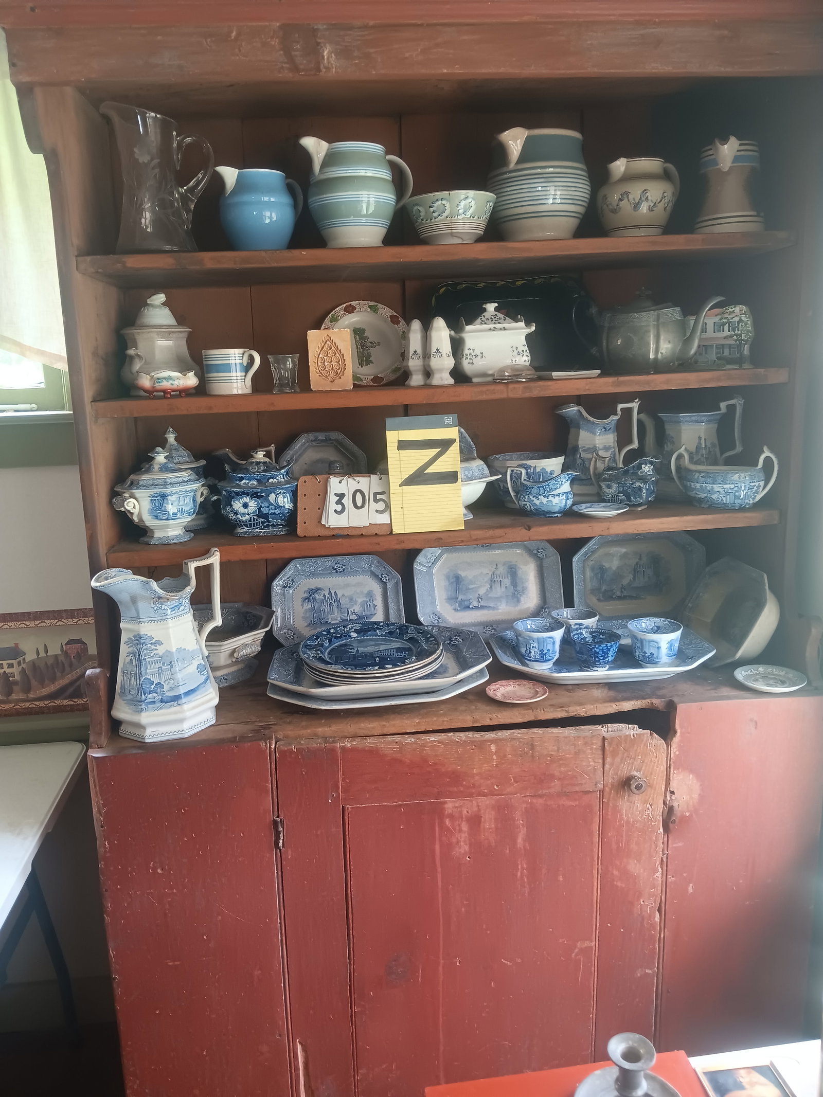 1830s American Step Back Cupboard: 1830s American step back cupboard with old red finish paint. Some damage to door. 48.5"w x 20"d x 79"d. See photos. From the Fairmont, NY estate of Carrie Gannett, and advanced antique, art and jewelr