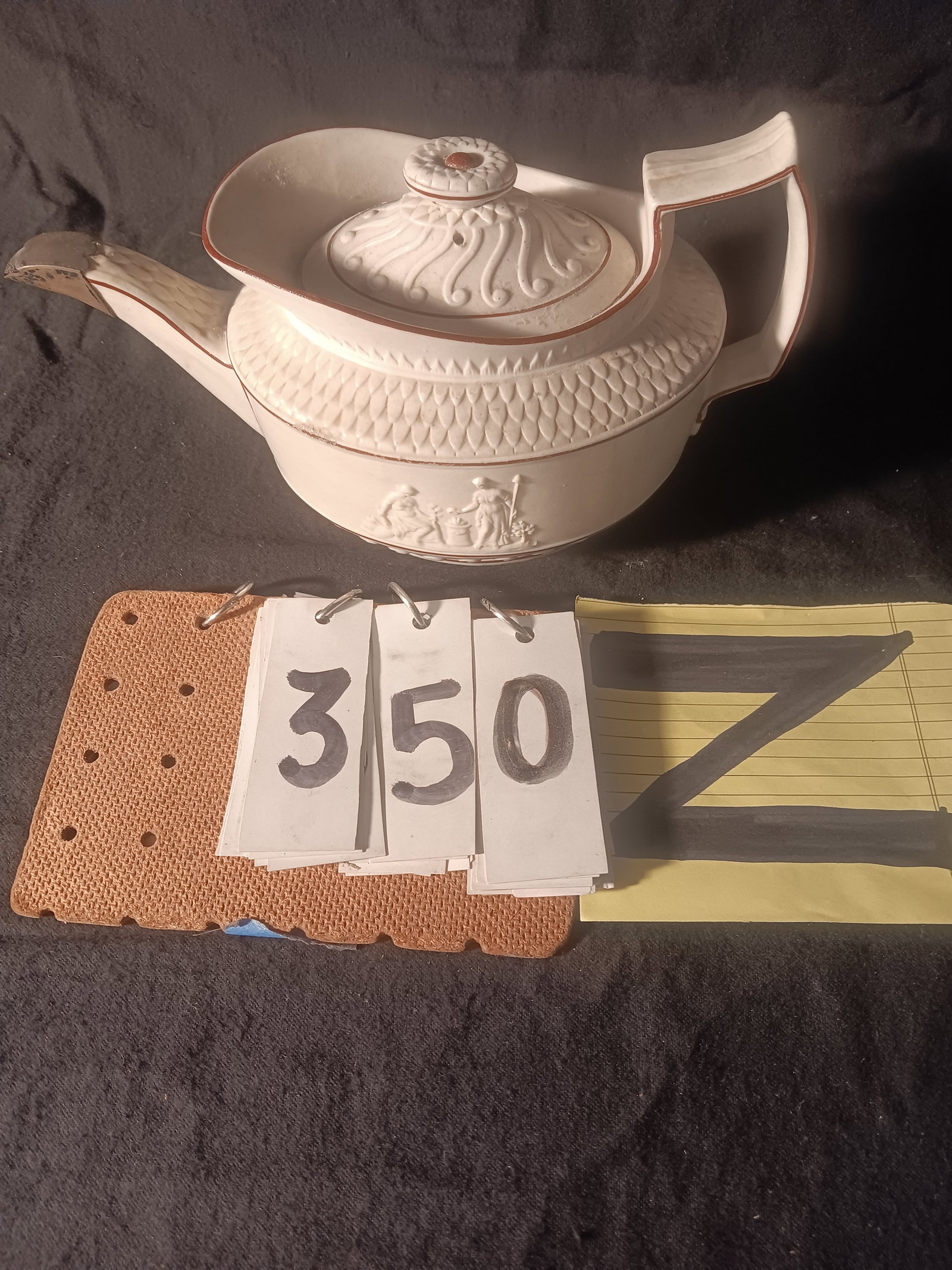 Early 1800s American Porcelain Teapot with Sterling Silver Spout: Early 1800s American porcelain teapot with sterling silver spout. Greek figures on the side with tip. Small chip on the inside of top rim. 9.875"w x 5.75"d x 5.5"h. See photos. From the Fairmont, NY e