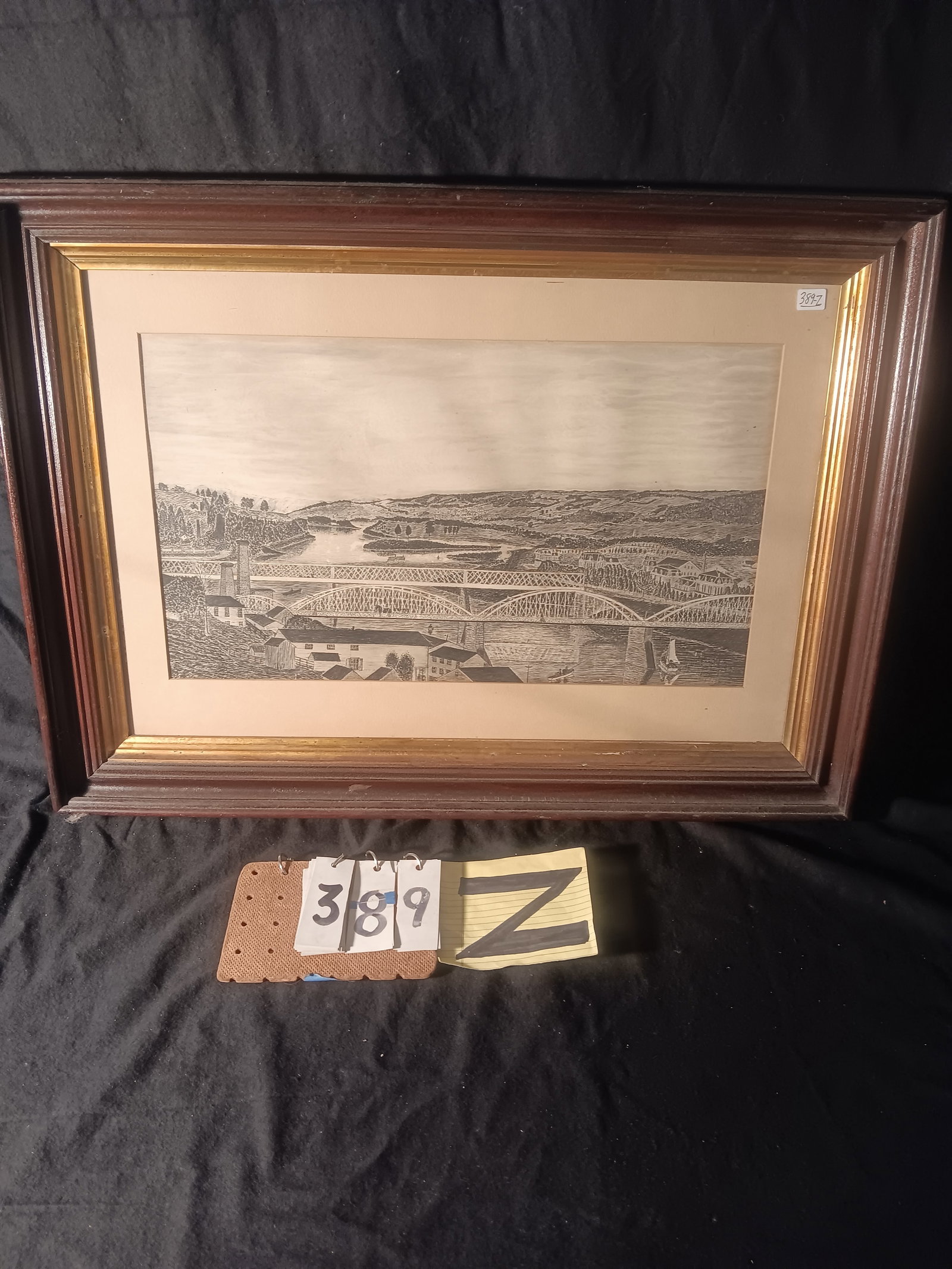 Nice Folk Art Pen and Ink Drawing Circa 1870s: Nice folk art pen and ink drawing circa 1870s in folk art frame. Has paddlewheel, horse and buggy on a bridge, train and more. Frame is 28.25"w x 20.5"h. Drawing is 20.25"w x 12"h. See photos. From th