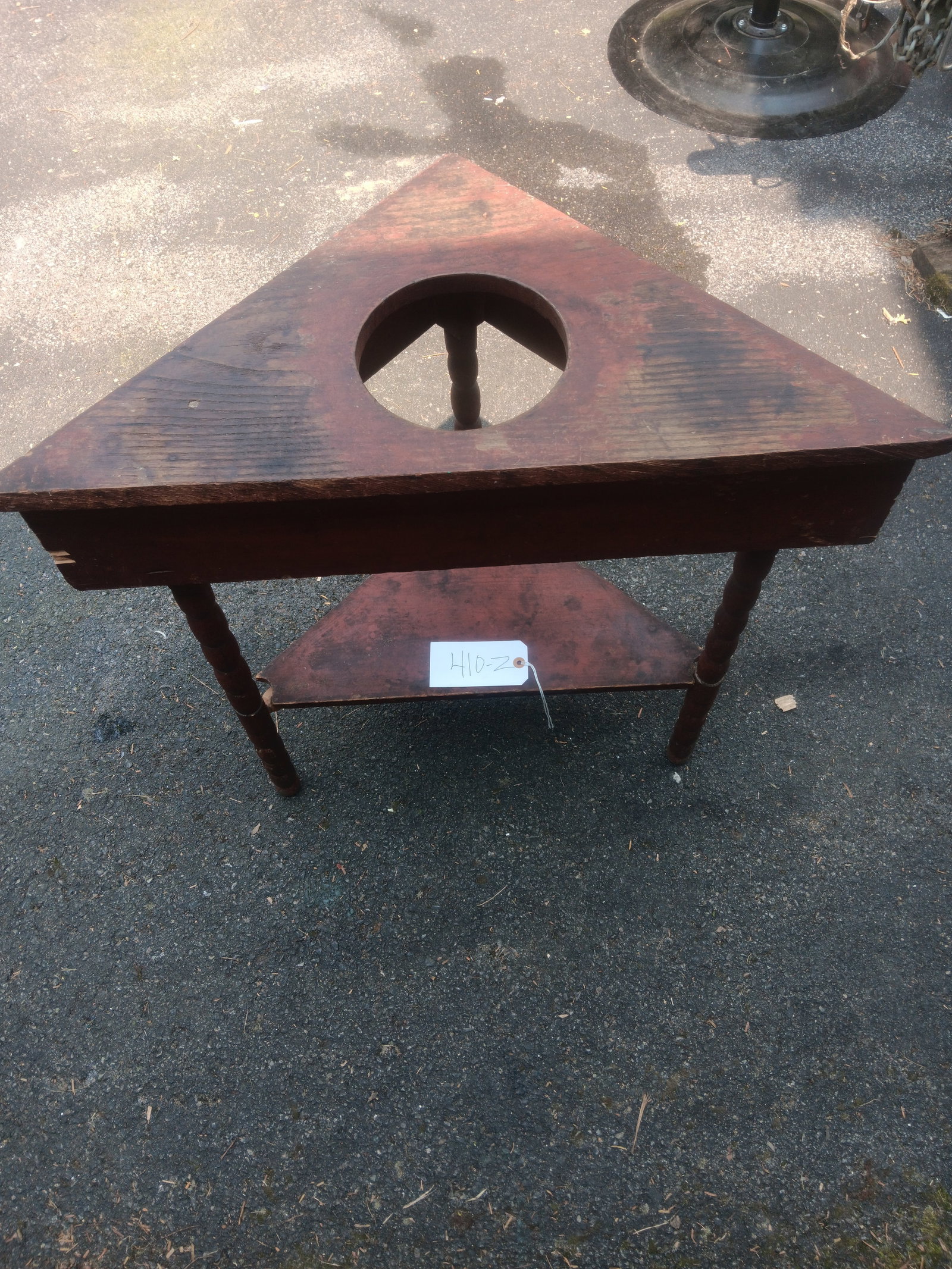 Three Sided Pitcher and Bowl Table: Three sided pitcher and bowl table with old red finish. 29.75"w x 15"d x 29"h. See photos. From the Fairmont, NY estate of Carrie Gannett, and advanced antique, art and jewelry collector.