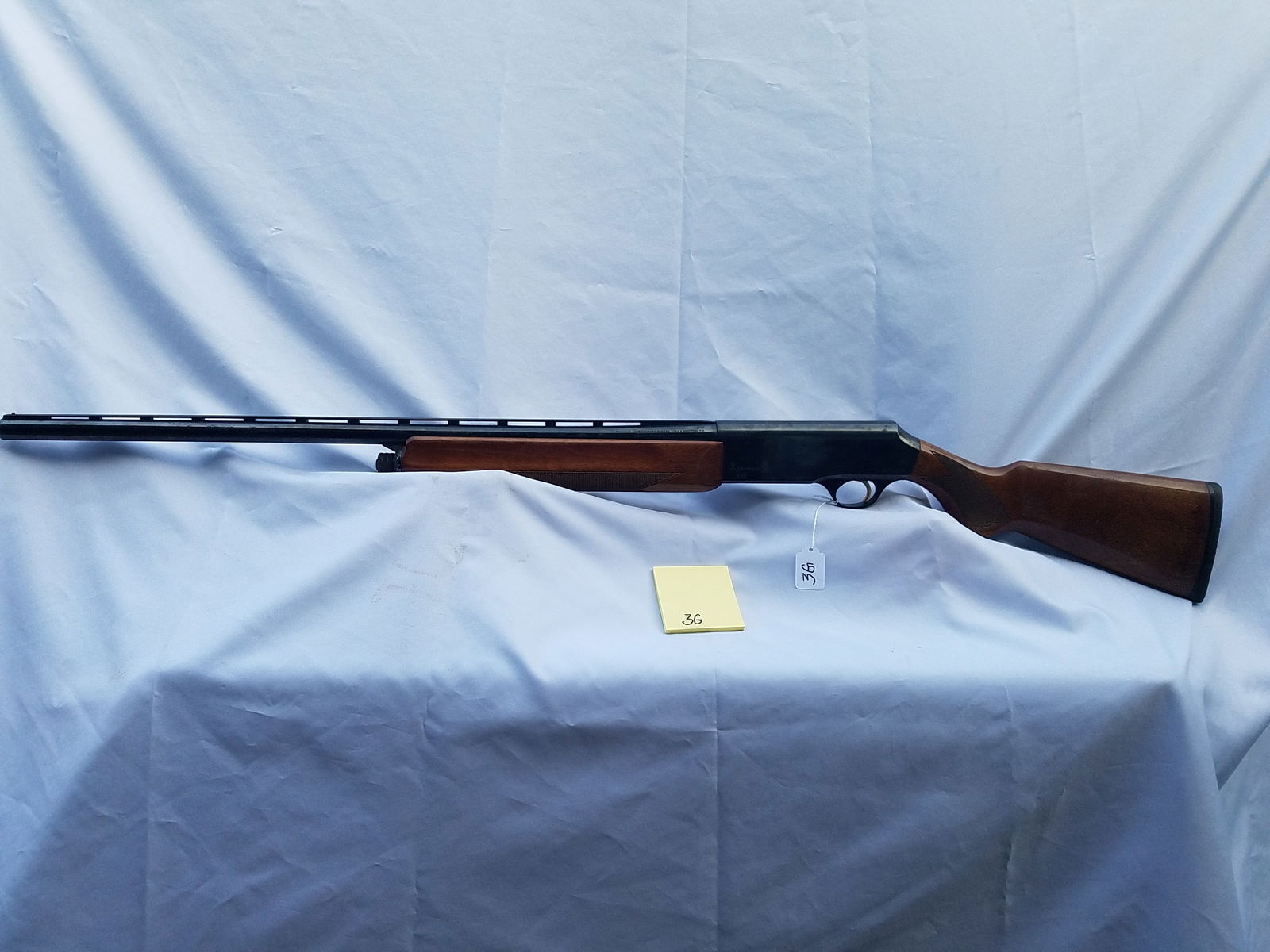 Browning Model B-80: Browning Model B-80. Semi-automatic 12 gauge, 3" magnum shells. 27" vent rib barrel, fixed full choke. Has some dings in the stock. Serial No. 411PX02704. See photos.