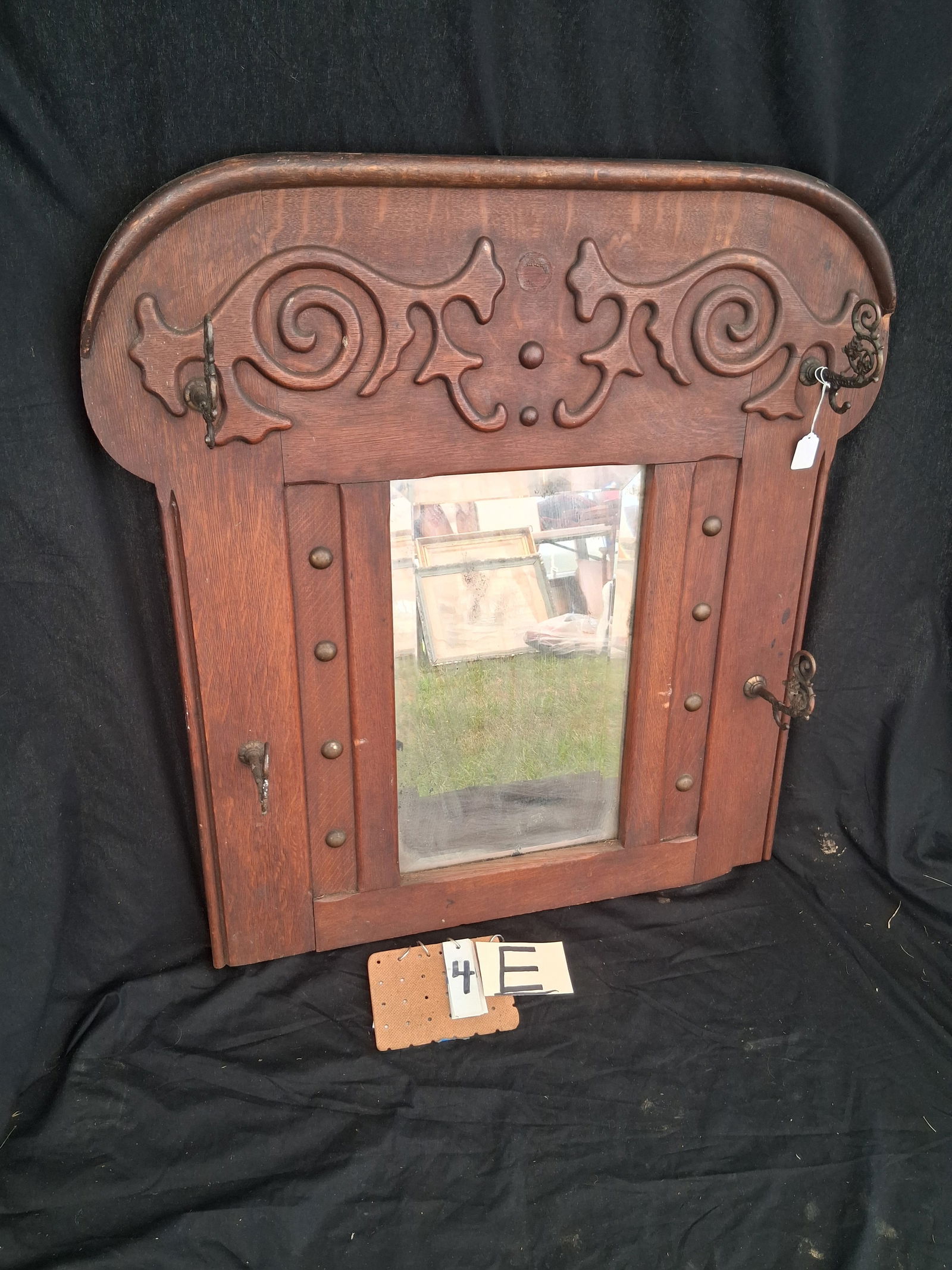 1890s American Oak Beveled Mirror and Coat Rack: 1890s American oak beveled mirror and four hook coat rack. 33"w x 34"h. See photos.