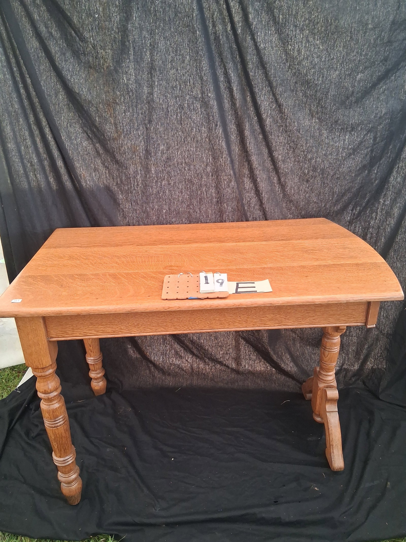 1890s Solid Carved Quartered Oak Three Leg Table: 1890s solid carved quartered oak three leg table, expertly refinished. 42"l x 24"w x 30"h. See photos.