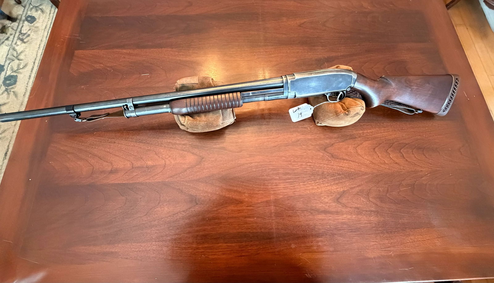 Winchester Model 12: Winchester Model 12. 12 gauge. 2.75" shells only. Original modified choke. 28" barrel. Leather sling. Removable magazine. Serial No. 1550215. See photos.