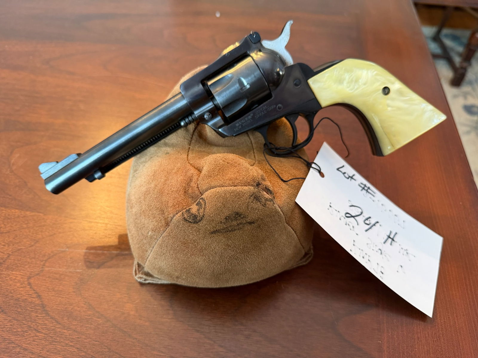 Ruger Single Six: Ruger Single Six. 22LR/22WMR. Both cylinders included. Aftermarket fake ivory grips (one is cracked). Serial No. 62-16667. See photos.