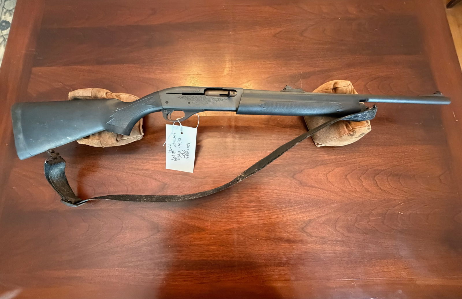 Remington Model 1100: Remington Model 1100. 20 gauge. 2.75" shells only. 20" rifled barrel. Little bit of rust. Serial No. R200988K. See photos.