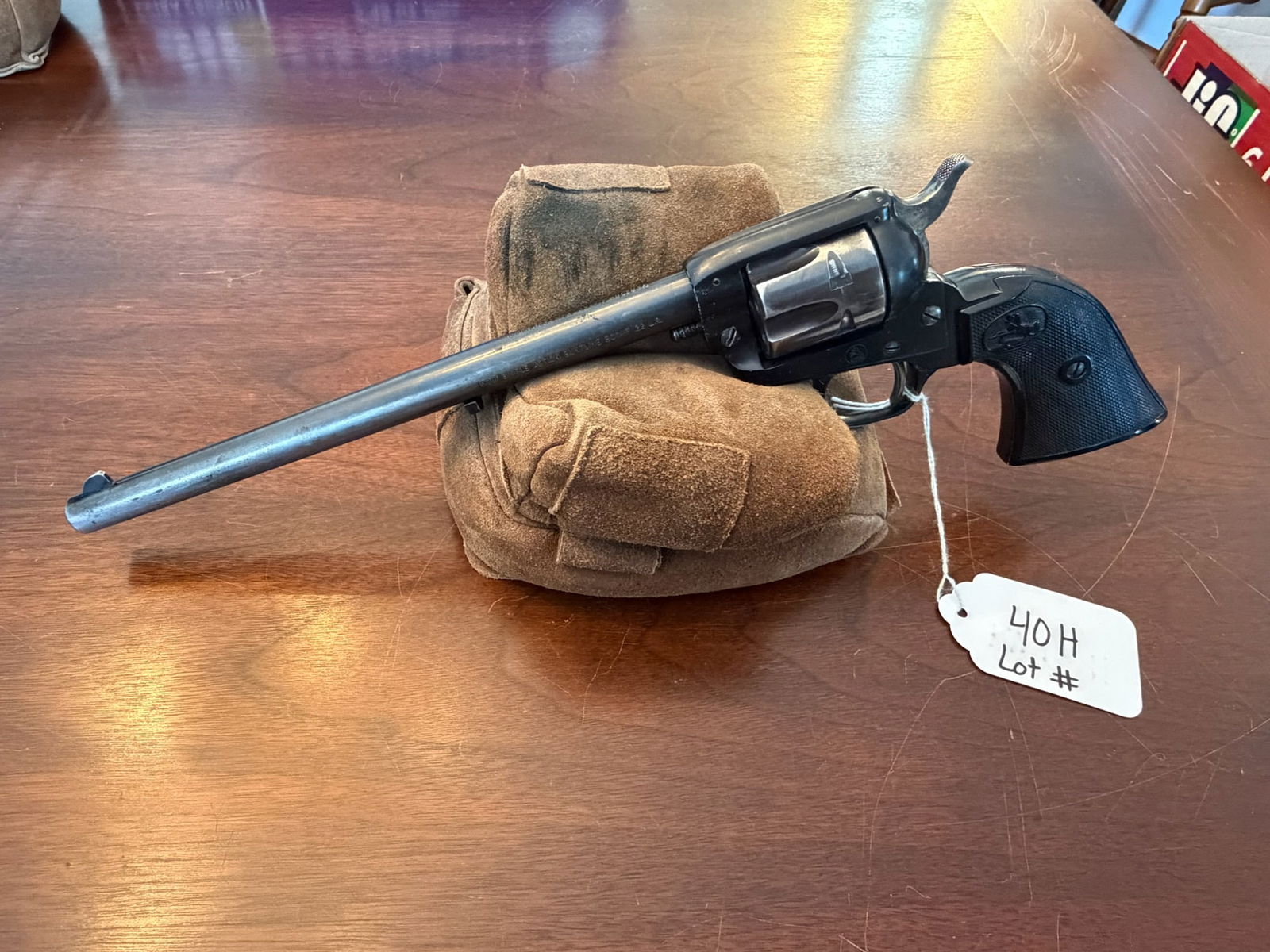 Colt Single Action Buntline: Colt Single Action Buntline. 22LR. With holster. Serial No. 186522F. See photos.