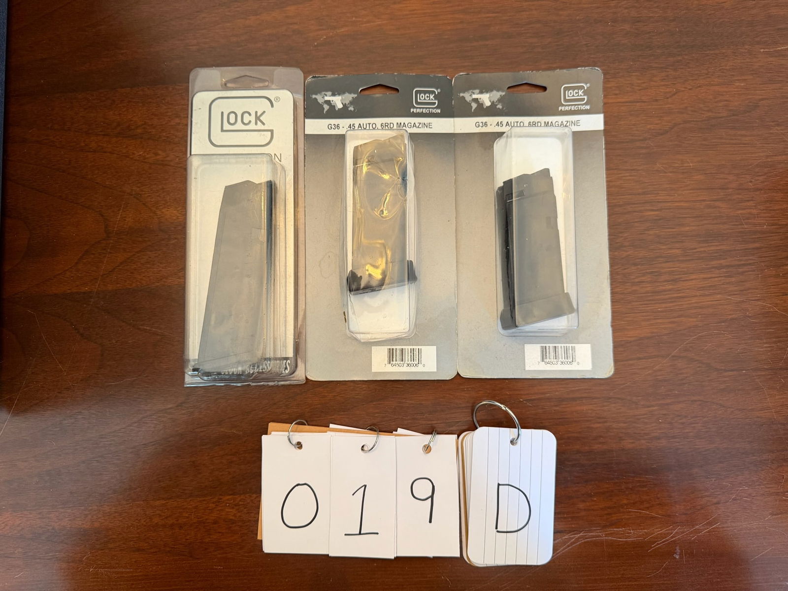 Three New Glock Magazines: Three new Glock magazines. Two Glock Model 36, 45 caliber, six round. One Glock Model 37, 45 GAP, ten round. See photos.