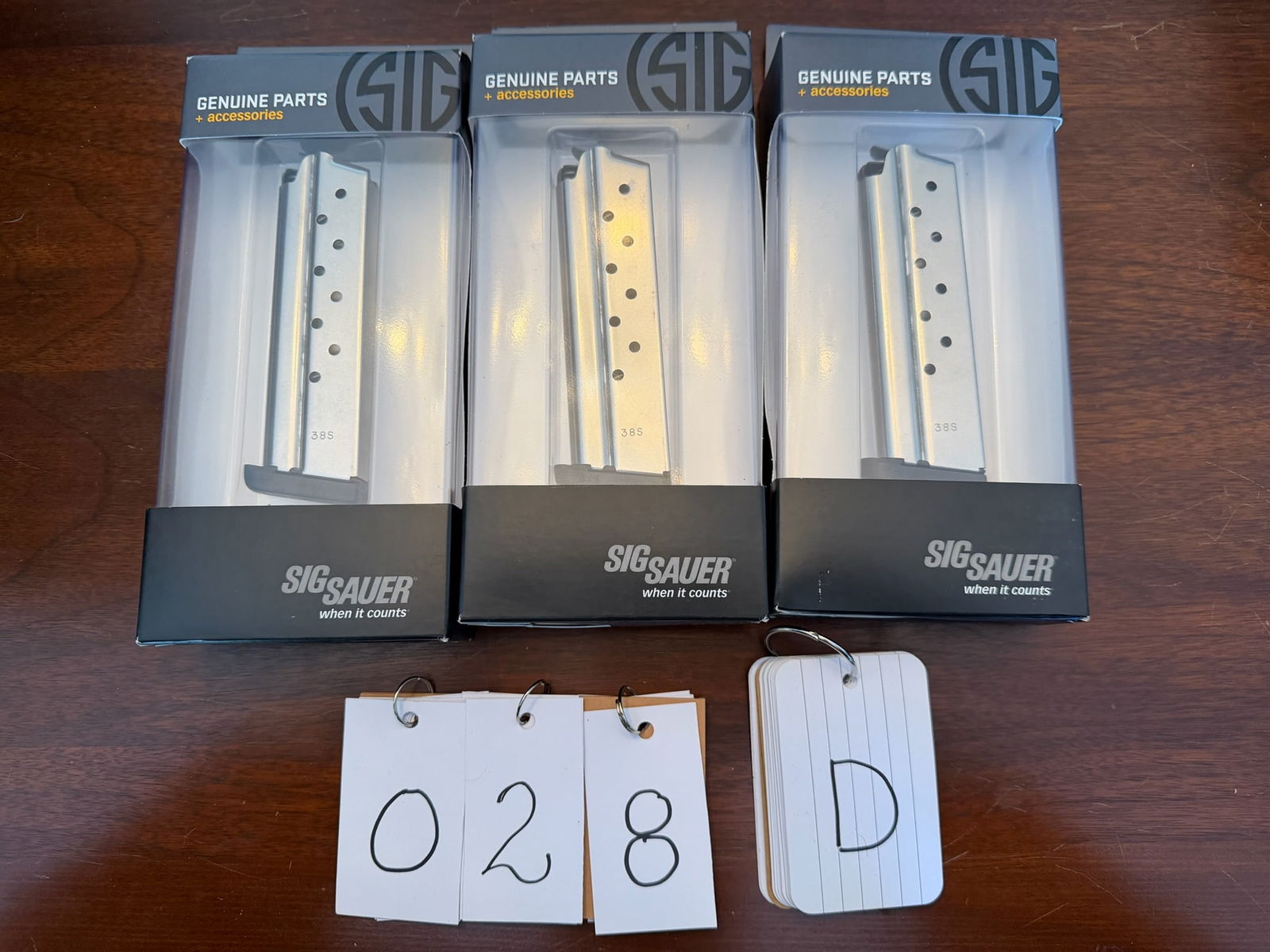 Three Sig Sauer 1911 Magazines: Three Sig Sauer 1911 magazines. 38 Super, nine round. New in the packages. See photos.