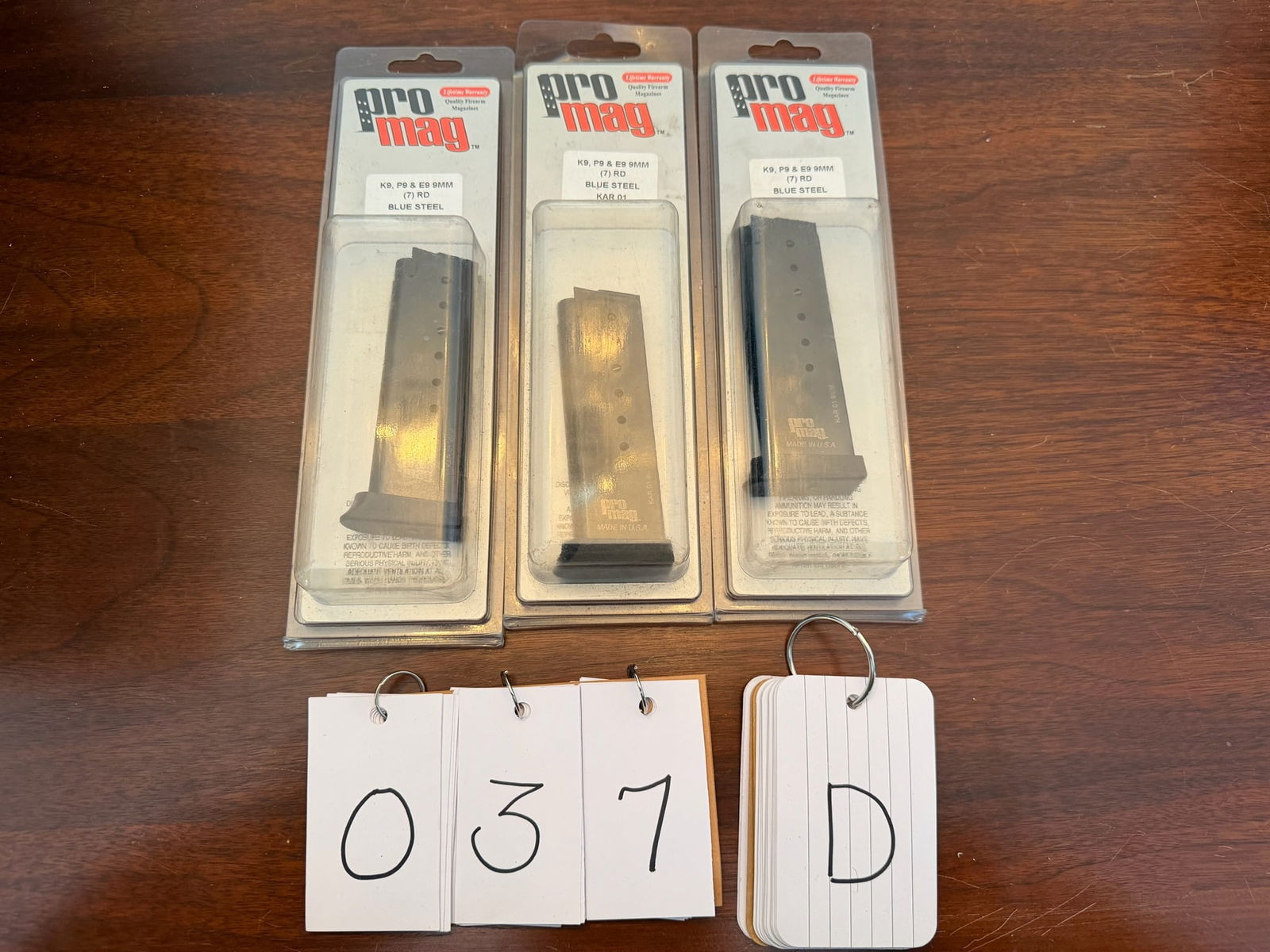 Three New Pro Mag Magazines: Three new Pro Mag magazines. K9, P9 and E9 9mm. Seven round, blue steel, KAR 01. New in the packages. See photos.