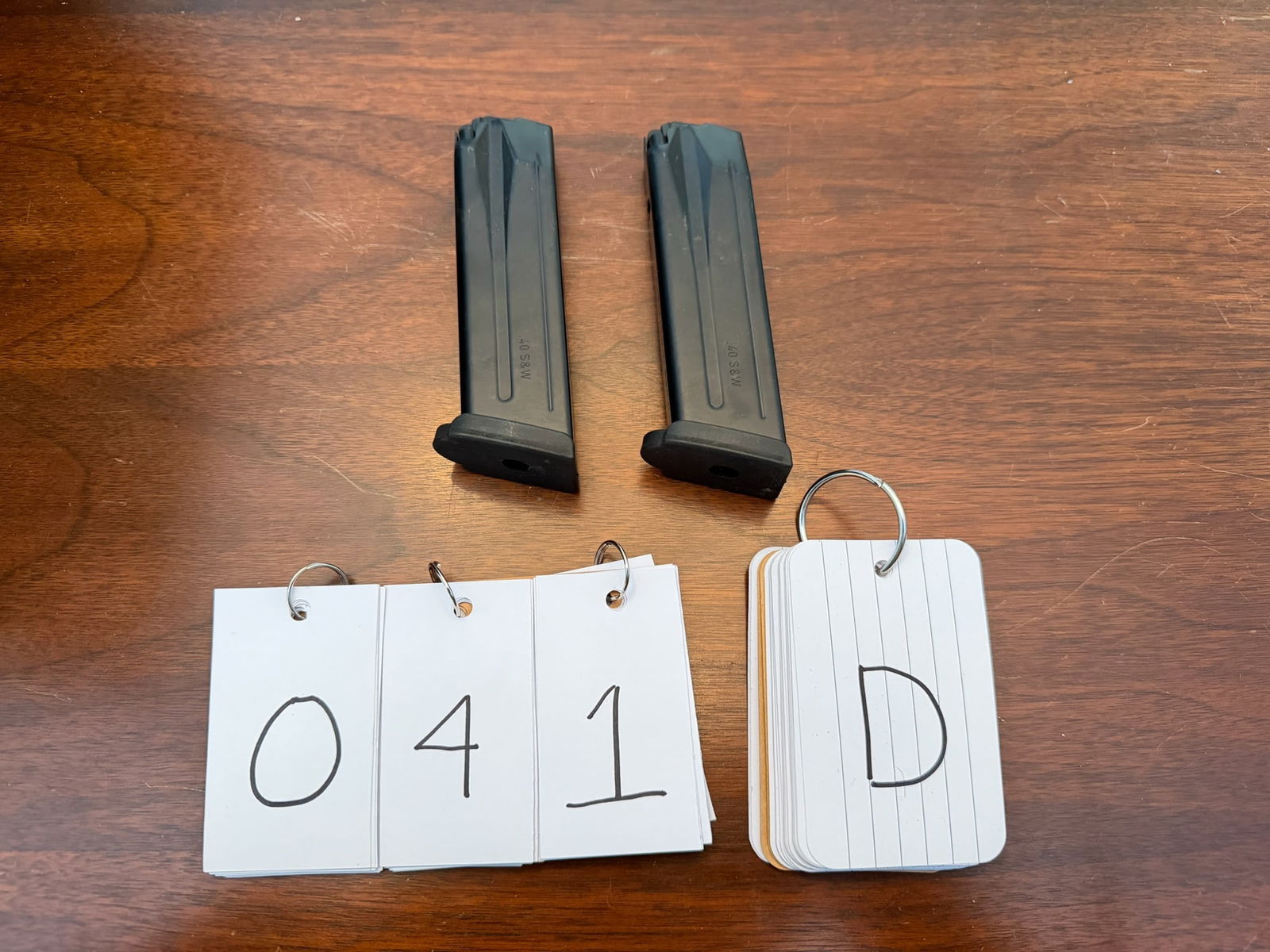 Two Sig Sauer 40 Smith & Wesson Magazines: Two Sig Sauer magazines in 40 Smith & Wesson. 13 rounds each. Stamped Made in Germany. See photos. LEO, FFL OR OUT OF STATE SALES ONLY. MAGAZINES ARE NOT NYS COMPLIANT.