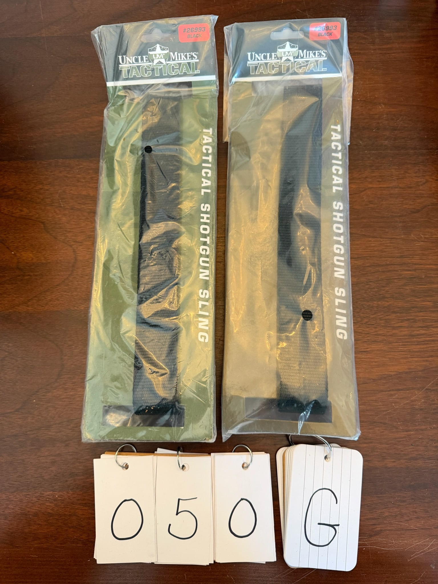 Assorted Lot of Shotgun Slings: Assorted lot of shotgun slings. Four Uncle Mike's tactical black nylon 1" slings. Part No. 26993. New in the packages. See photos.