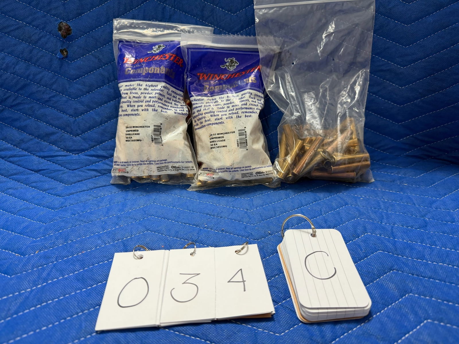 38-55 Winchester Brass: 38-55 Winchester brass casings. Two brand new bags of Winchester, 50 unprimed casings (100 total). 33 once fired casings. See photos.