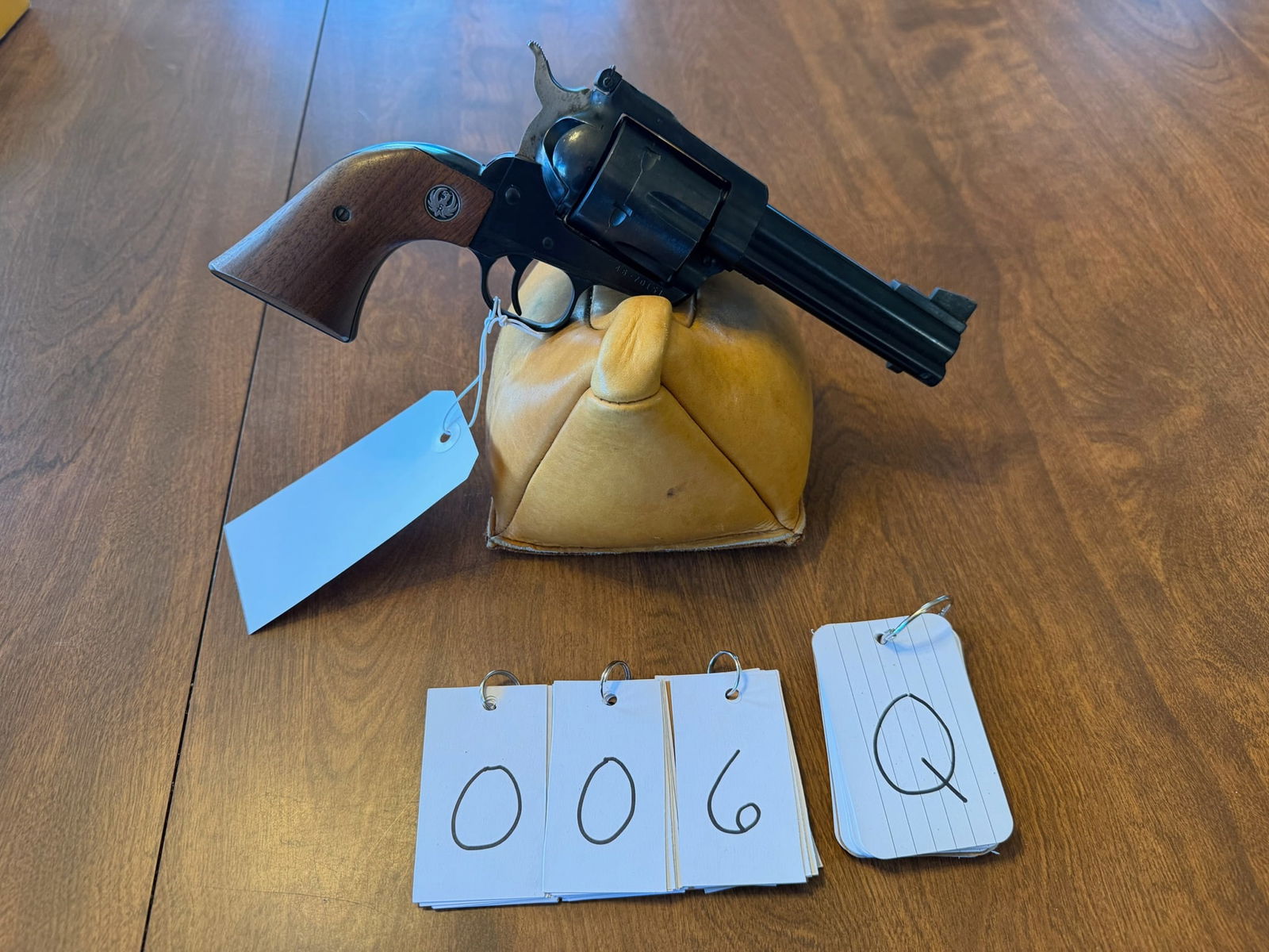 Ruger New Model Blackhawk: Ruger New Model Blackhawk. 45 caliber. 4.625" barrel. Blued single action six-shot revolver. Comes with the original box. Does have minor cylinder drag line. Serial No. 46-70151. See photos.