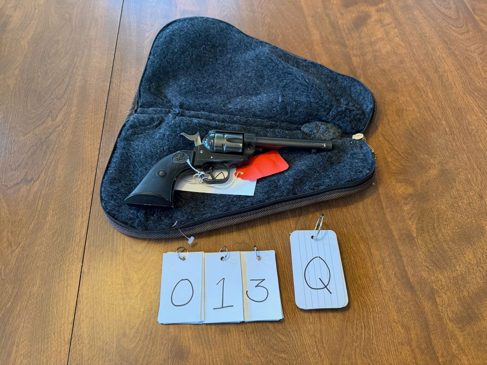 Colt Frontier Scout: Colt Frontier Scout. 22LR. 4.625" barrel. Blued single action six-shot revolver. Comes with a lockable soft pouch case (keys included). Serial No. 58967F. See photos.
