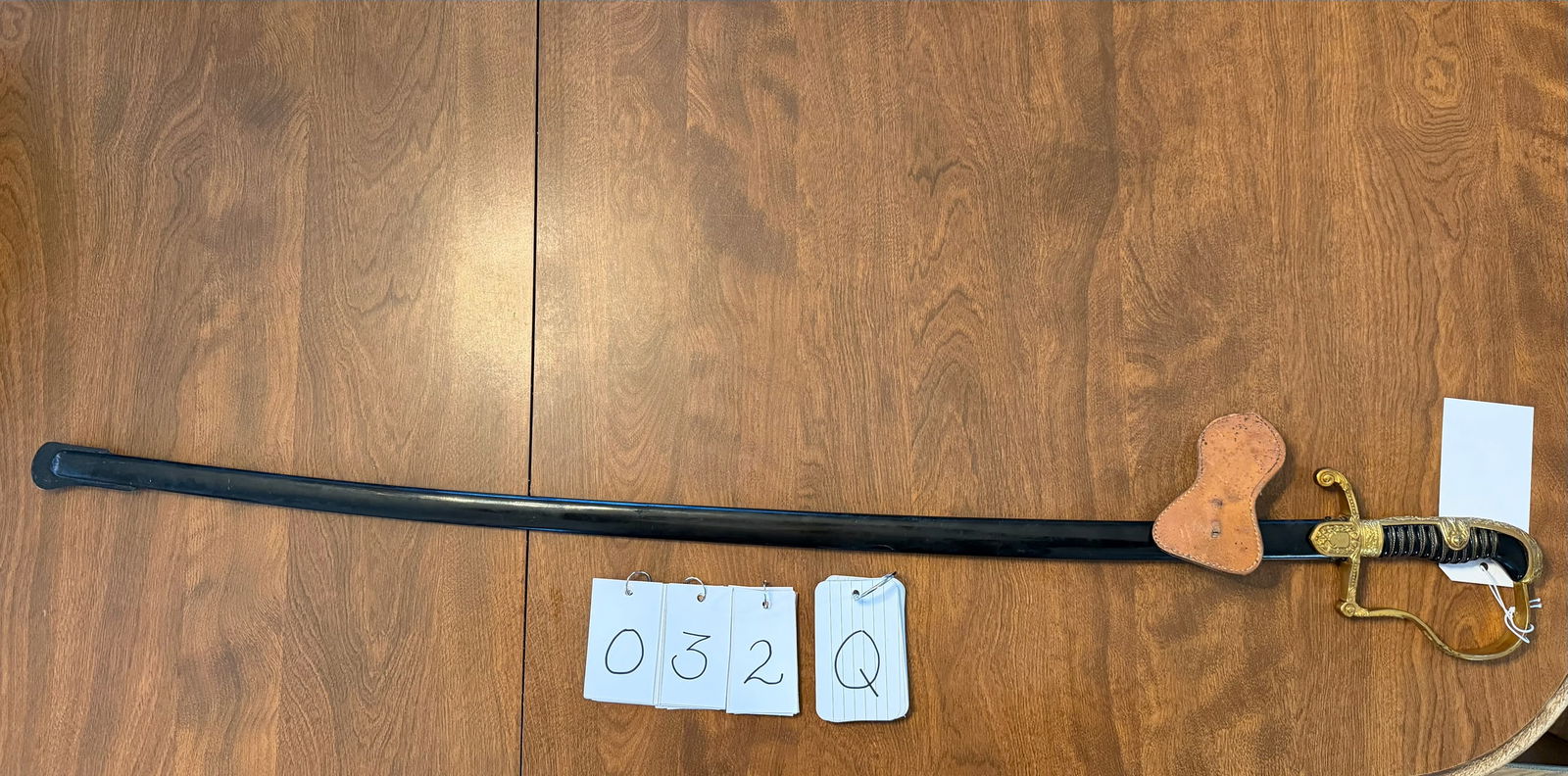 Third Reich Dove Head Sword with Scabbard: Third Reich Dove Head sword with scabbard. 38" total length. Has a Knights head on the blade with WKC below it. In excellent condition. See photos.