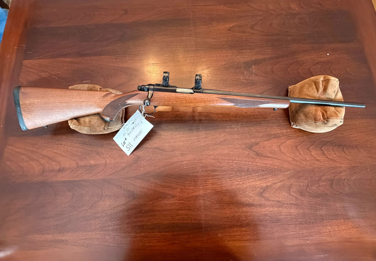 Ruger Model 77/22 MK II: Ruger Model 77/22 MK II. 22 Winchester Magnum. 20" barrel. Minor scuffs and dings on stock. Comes with scope rings. Serial No. 701-15856. See photos.