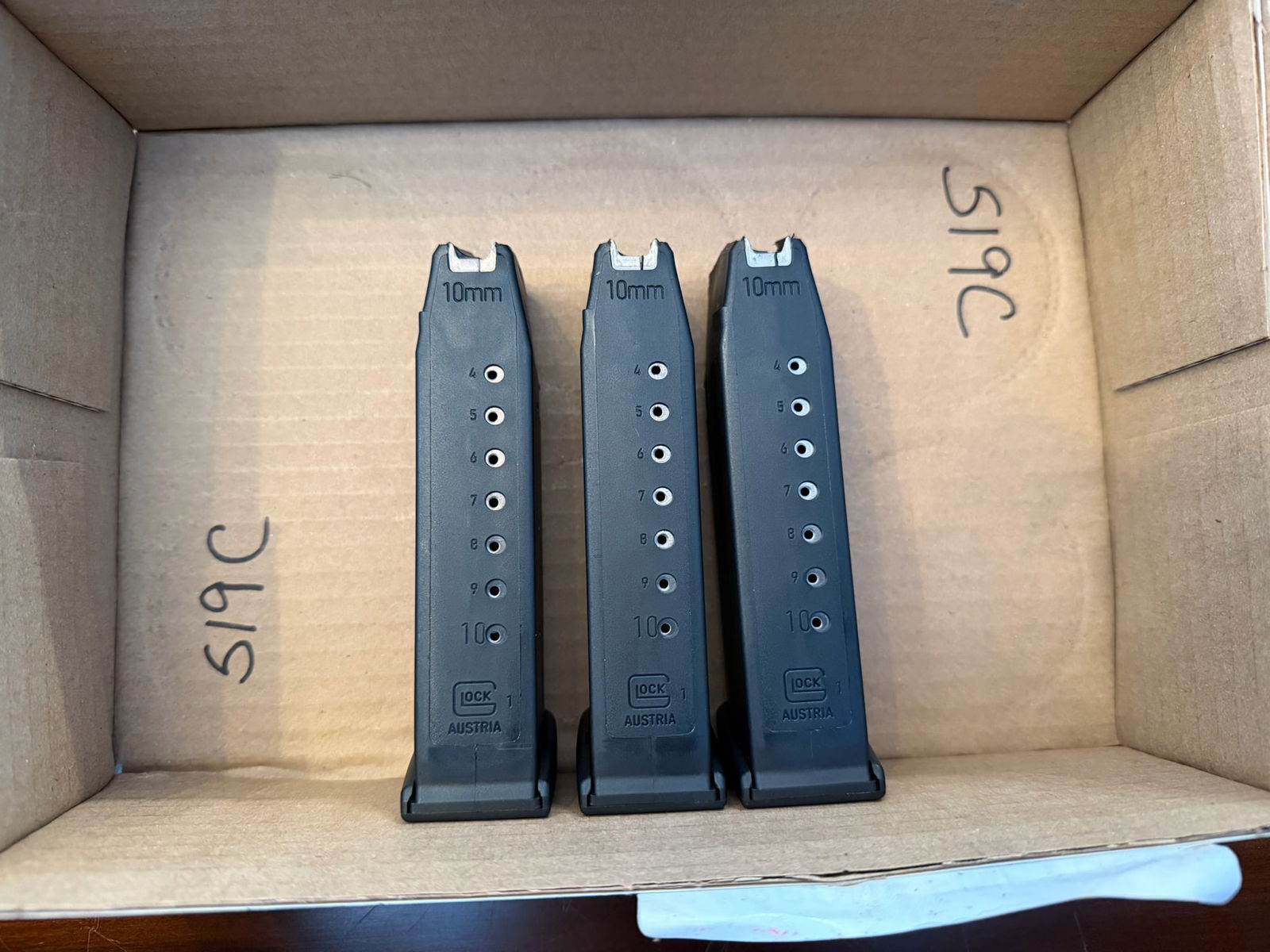 Three Glock Ten Round 10mm Magazines: Three Glock ten round 10mm magazines. See photos.