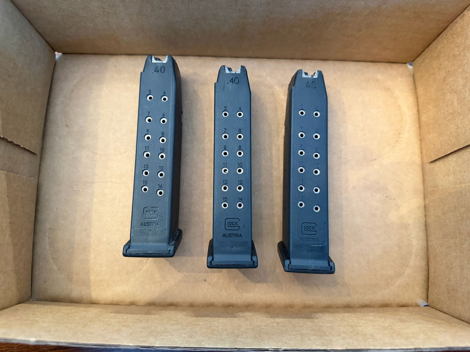 Three Glock 15 Round 40 Caliber Magazines: Three Glock 15 round 40 Caliber magazines. See photos. LEO, FFL OR OUT OF STATE SALES ONLY. MAGAZINES ARE NOT NYS COMPLIANT.