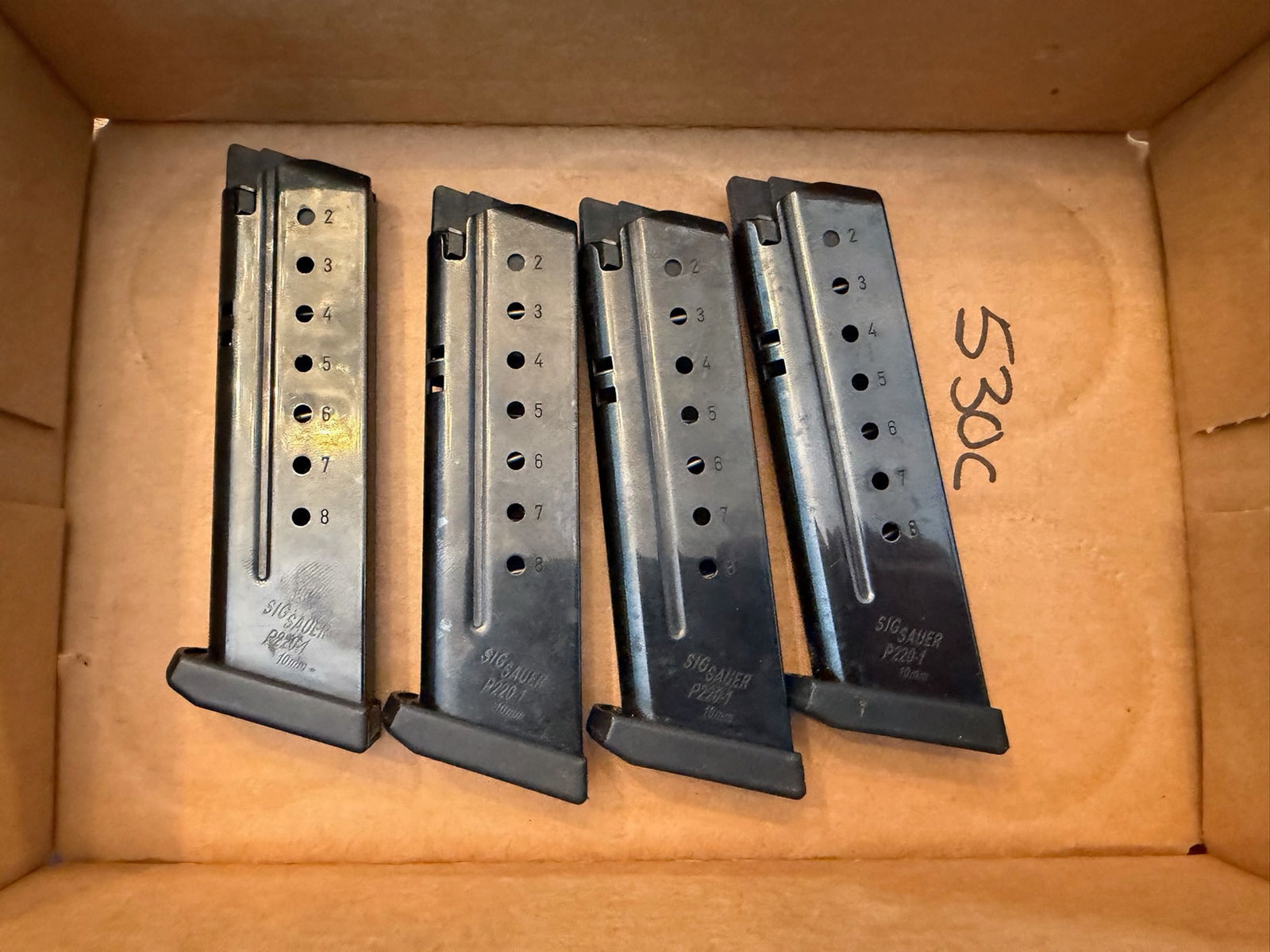 Four Sig Sauer P220 Eight Round 10mm Magazines: Four Sig Sauer P220 eight round 10mm magazines. See photos.