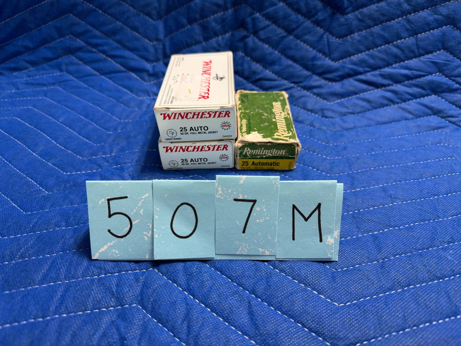 25 Auto Ammo: 25 Auto ammunition. Two boxes of Winchester, 50 grain FMJ (100 rounds). One box of Remington, 50 grain metal cased (30 rounds). 130 rounds total. See photos.