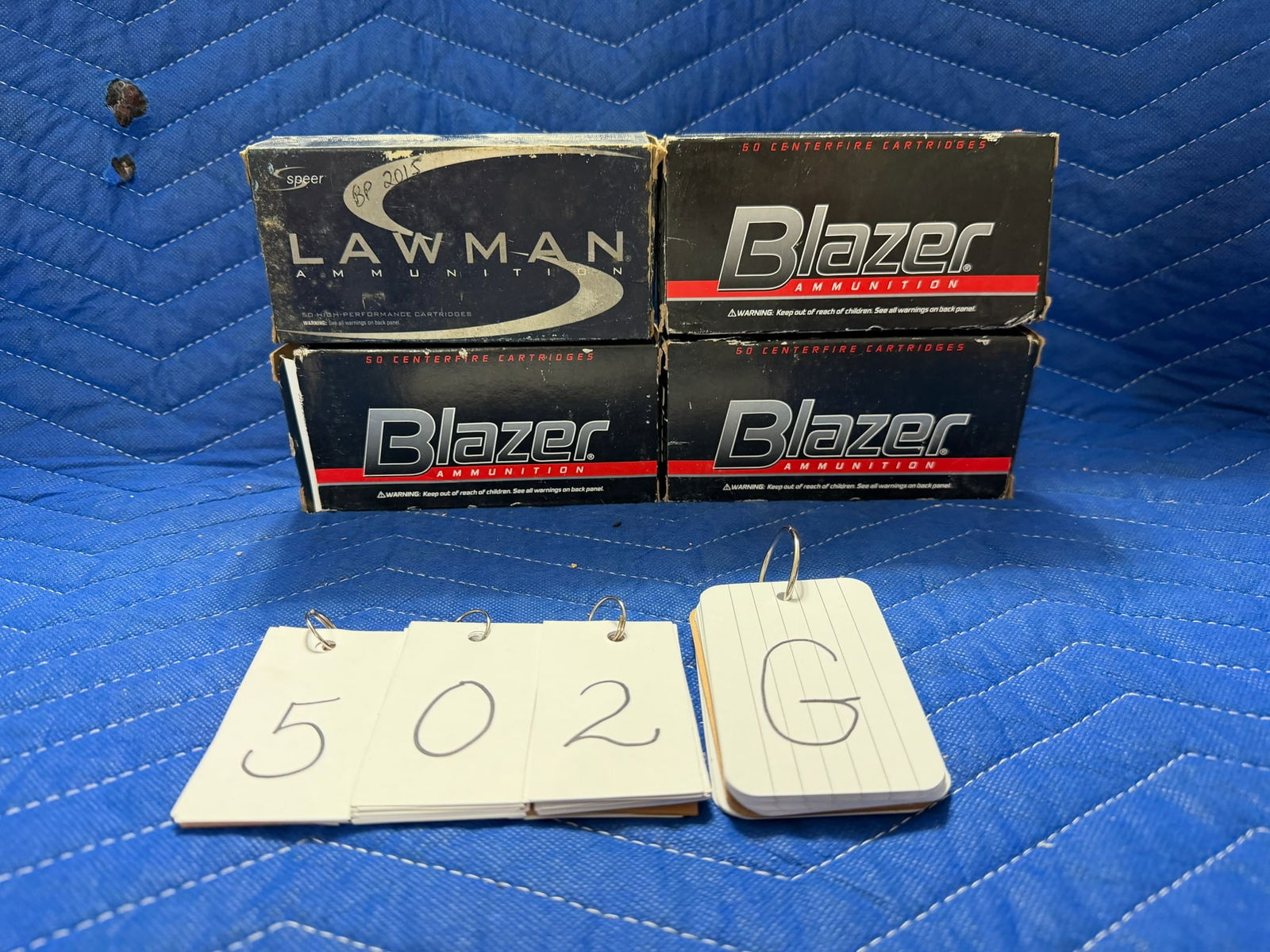 45 Auto Ammo: 45 Auto ammunition. Three boxes of Blazer, 230 grain FMJ (138 rounds). One box of Speer Lawman, 230 grain TMJ (22 rounds). 160 rounds total. See photos.