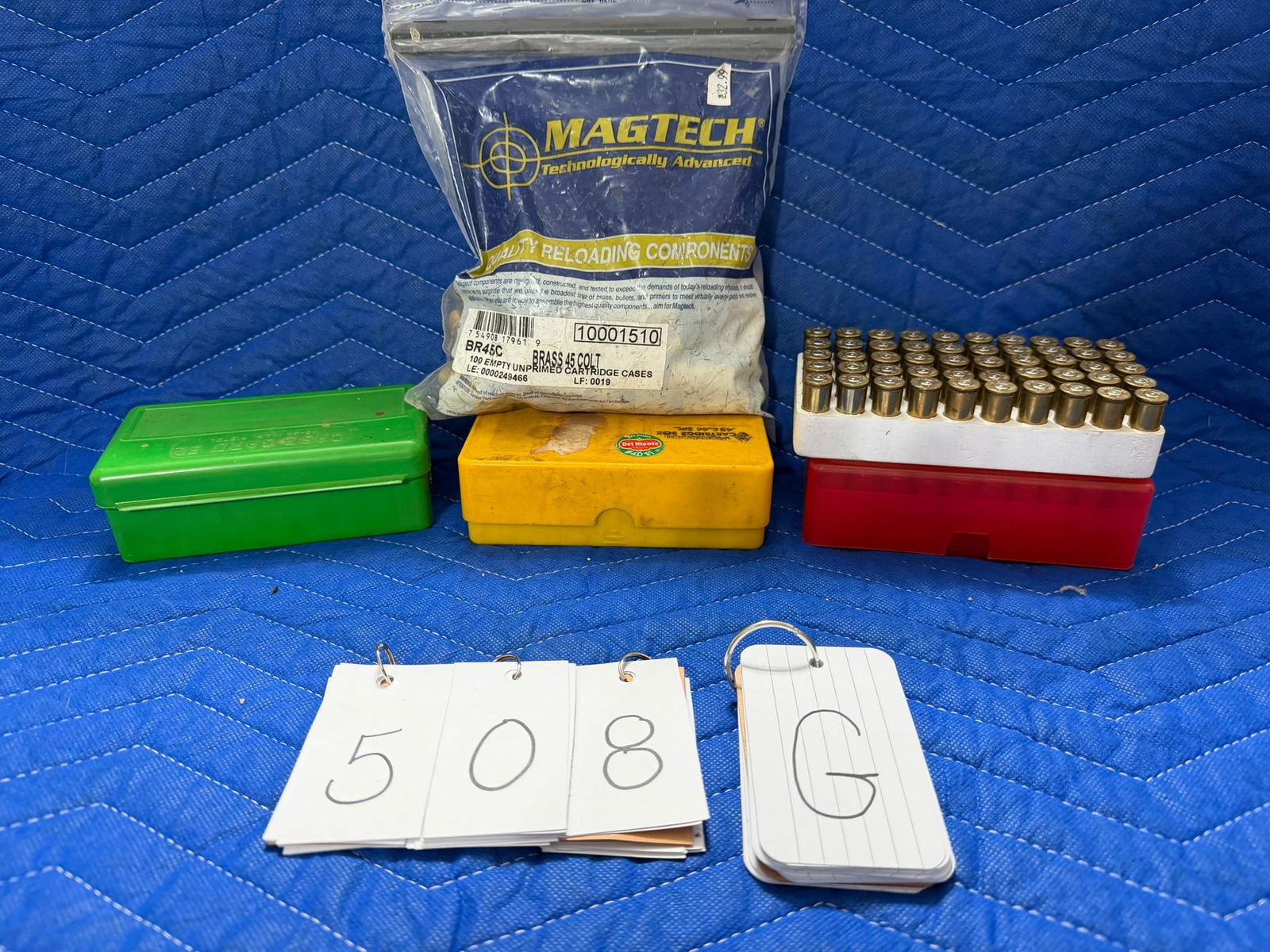 45 Colt Ammo and Brass: 45 Colt ammunition and brass casings. 109 rounds in polymer cases. 91 once fired brass casings in polymer cases. 100 brand new unprimed brass casings by MagTech. See photos.