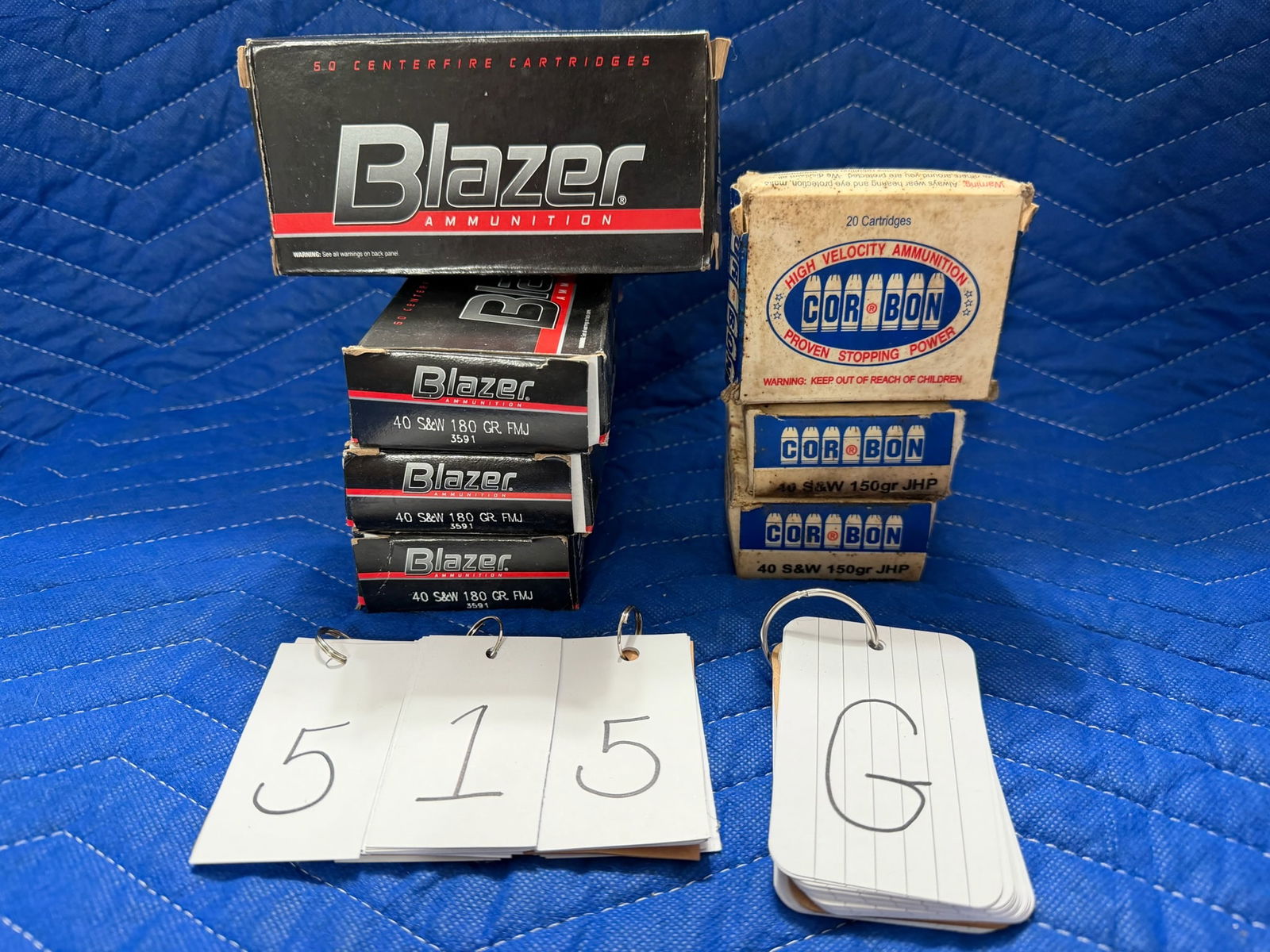 40 Smith & Wesson Ammo: 40 Smith & Wesson ammunition. Four boxes of Blazer, 180 grain FMJ (200 rounds). Three boxes of Cor Bon, 150 grain JHP (60 rounds). 260 rounds total. See photos.