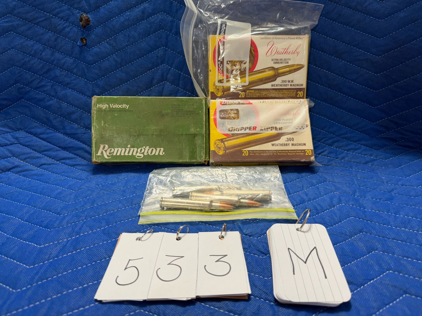 300 Weatherby Magnum Ammo: 300 Weatherby Magnum ammunition. Two vintage boxes of Weatherby, 180 grain ultra velocity SP noslers (40 rounds). One box of Remington, 180 grain core-lokt SP (20 rounds). Includes four loose rounds.