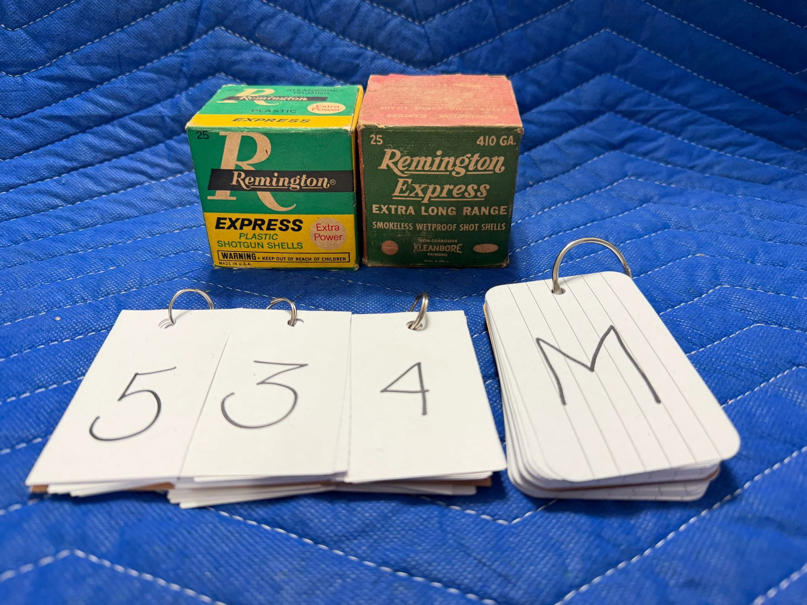410 Gauge Shotgun Ammo: 410 gauge shotgun ammunition. One vintage box of Remington Express, extra long range, 2.5" shells (25 rounds). One vintage box of Remington Express, 2.5" shells (25 rounds). 50 rounds total. See