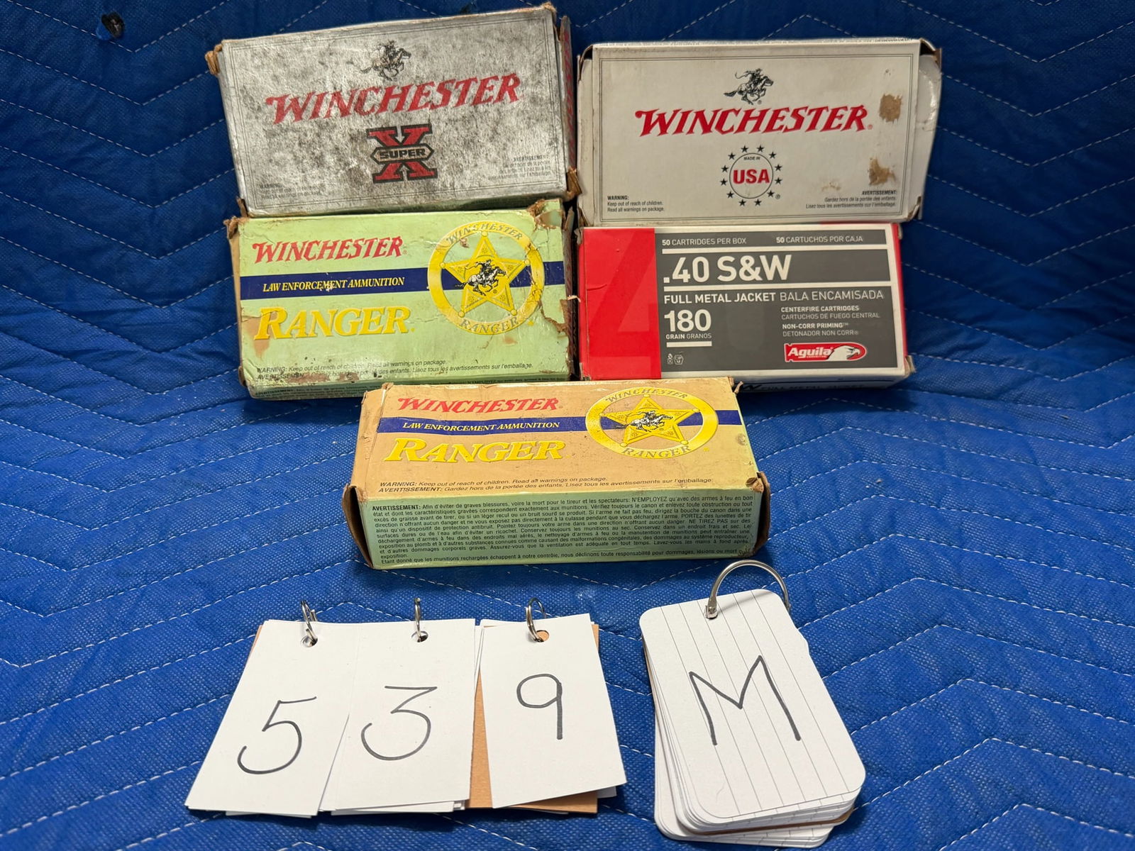 40 Smith & Wesson Ammo: 40 Smith & Wesson ammunition. Two boxes of Winchester Ranger, 155 grain JHP (77 rounds). One box of Winchester, 180 JHP (50 rounds). One box of Aguila, 180 grain FMJ (30 rounds). One box of