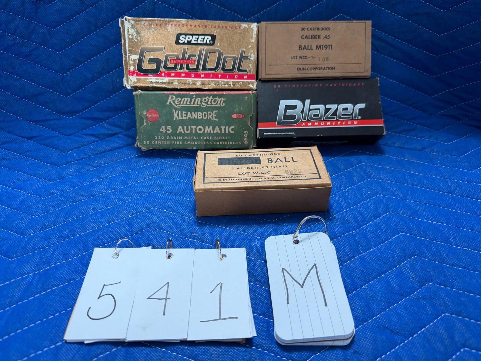 45 Auto Ammo: 45 Auto ammunition. One vintage box of Remington Kleanbore, 230 grain metal cased bullets (43 rounds). Two boxes of Military, 45 caliber M1911 ball, manufactured by Olin Mathieson Chemical