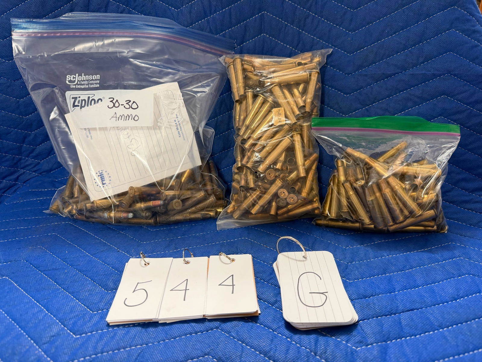 30-30 Winchester Ammo and Brass: 30-30 Winchester ammunition and brass casings. 93+ loose rounds. Plus 4.4 pounds of brass casings. Approximately 51 casings per pound. See photos.