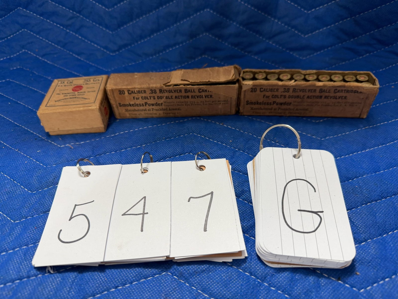 38 Caliber Ammo: Three vintage boxes of 38 caliber ammunition. Two boxes of 38 caliber revolver ball cartridges for Colt Double Action revolvers, manufactured at Frankford Arsenal (40 rounds). One box of 38 caliber