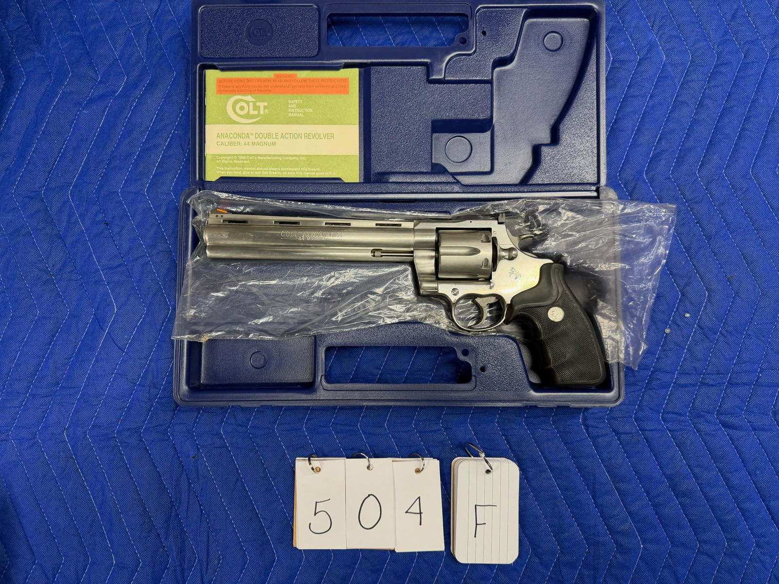 Colt Anaconda: Colt Anaconda double action revolver. 44 Magnum. 8" stainless barrel. Comes with original plastic case, cardboard box and paperwork. In excellent condition. Serial No. MM19654.