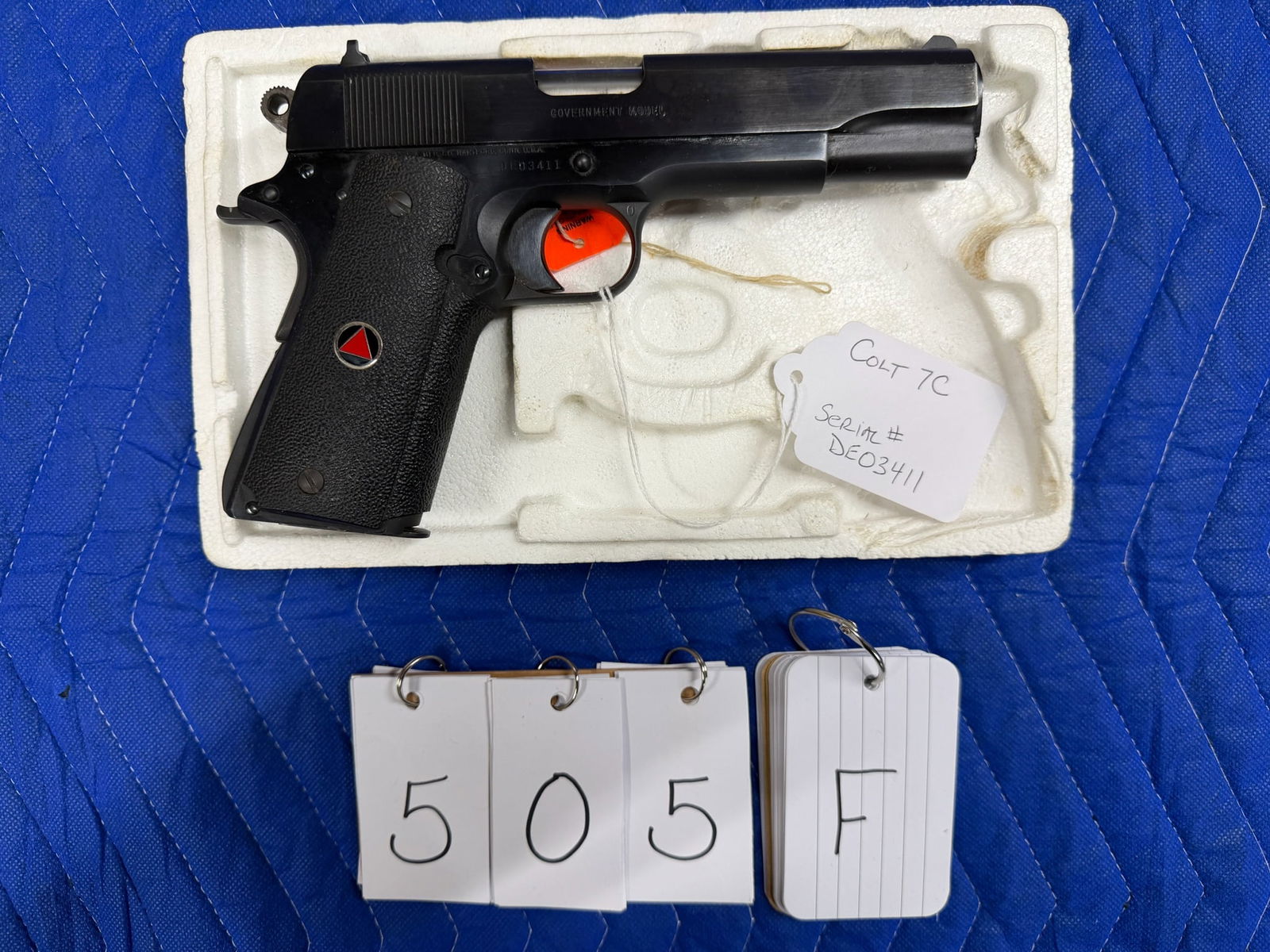 Colt Delta Elite: Colt Delta Elite. 10mm. 5" barrel, blued finish. Unfired with the original cosmoline grease. Packed in the original box with the original paperwork. Serial No. DE03411. See photos.