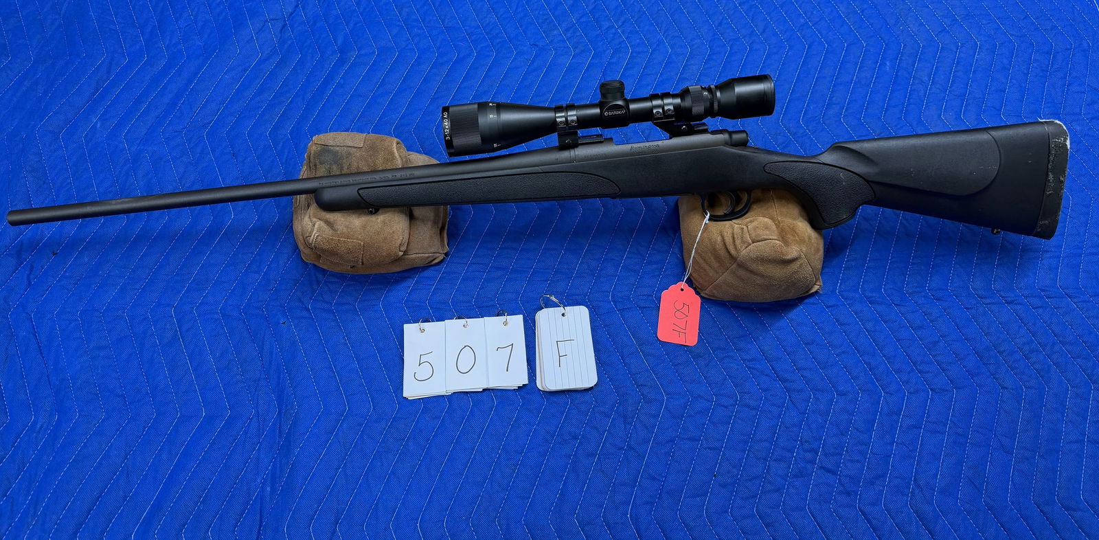 Remington Model 700BDL: Remington Model 700BDL. 243 Winchester. 24" barrel. Has a Barska 3-12x40mm scope and black synthetic stock. Needs new butt pad, otherwise in excellent condition. Serial No. G6528373. See photos.