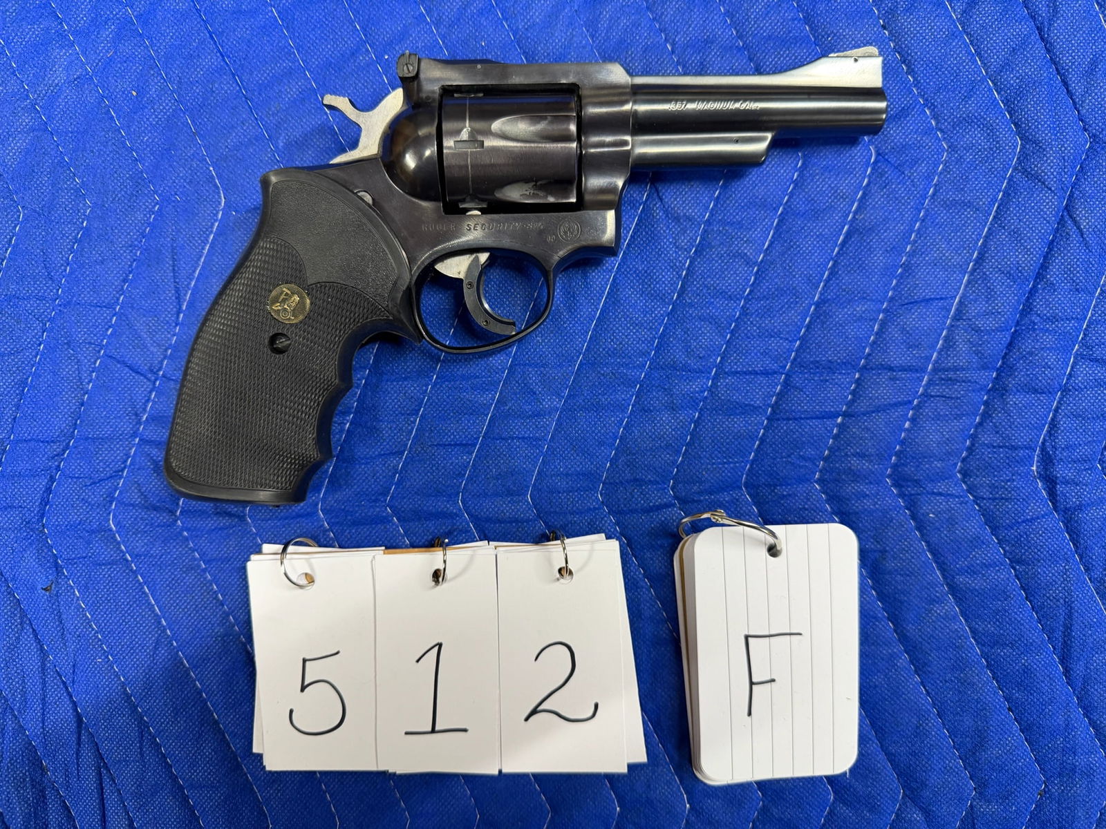 Ruger Security Six: Ruger Security Six. 357 Magnum. 4" barrel. Blued. Six shot revolver. Black rubber Pachmayr grips. In excellent condition. Minor cylinder drag line. Serial No. 154-83027. See photos.