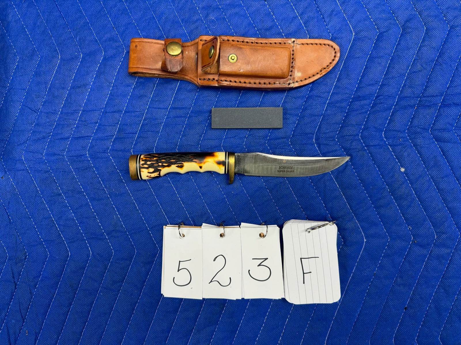 Uncle Henry Golden Spike Knife: Uncle Henry Golden Spike Knife. Manufactured by Schrade. Early Model 153UH. Comes with leather sheath, sharpening stone, original box and original paperwork. 5" blade, 9.25" long overall. See photos.