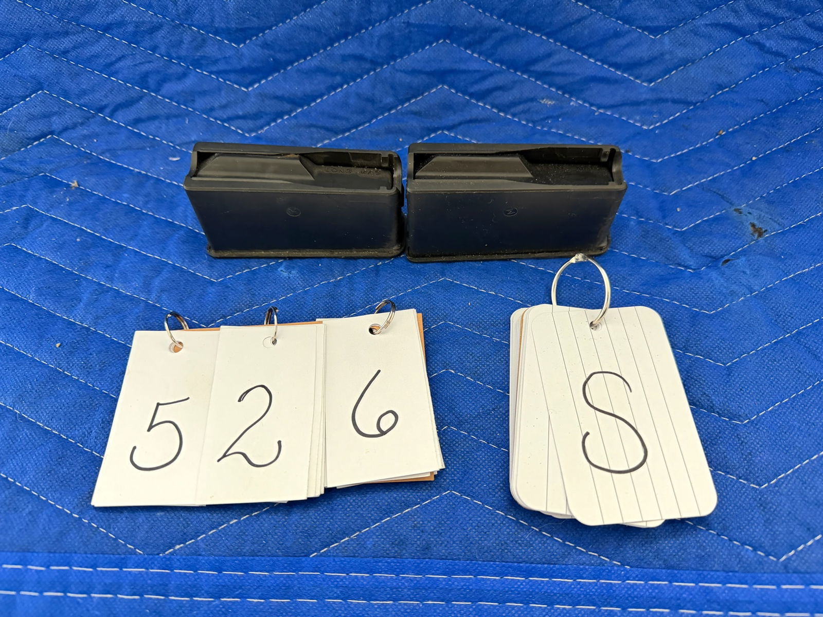 Two Mossberg Magazines: Two Mossberg rifle magazines. See photos.