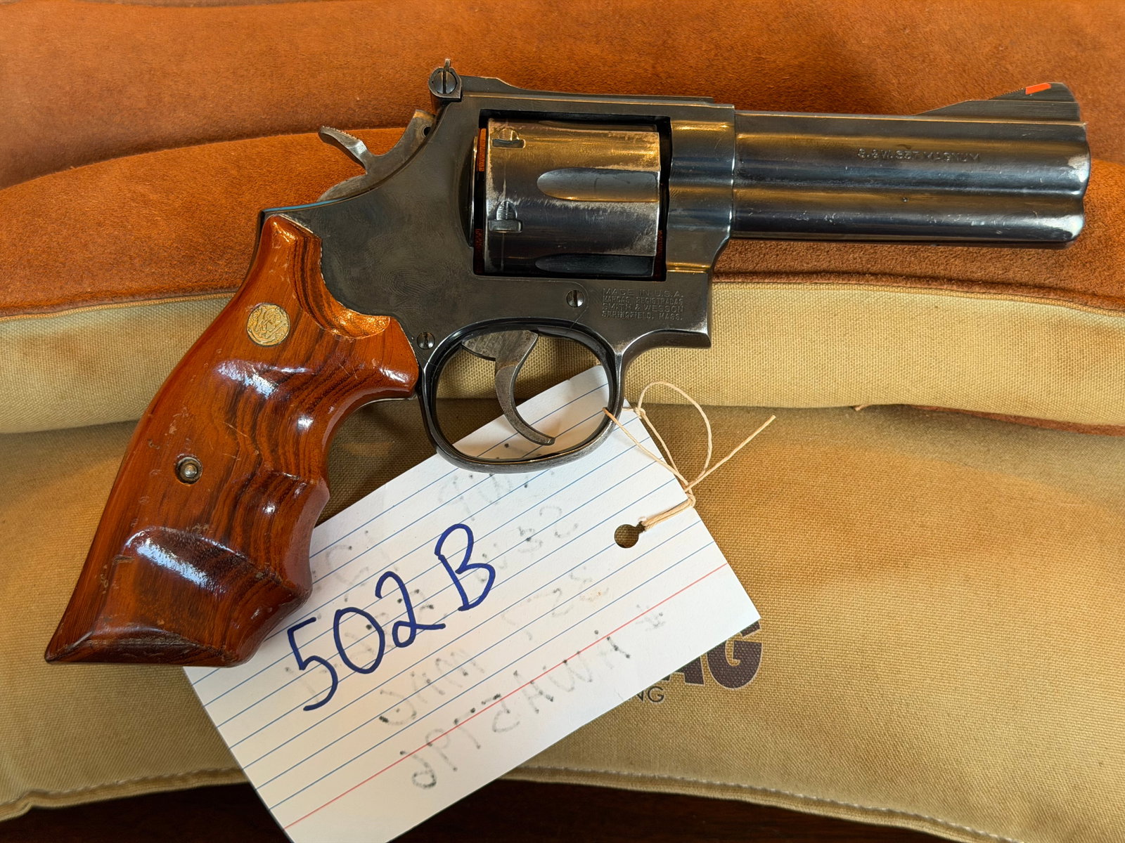 Smith & Wesson Model 586-1: Smith & Wesson Model 586-1. 357 Magnum. Six shot revolver. Has cylinder drag line and finish wear on cylinder and muzzle. Has Altamont grips. Serial No. AWA5796. See photos.