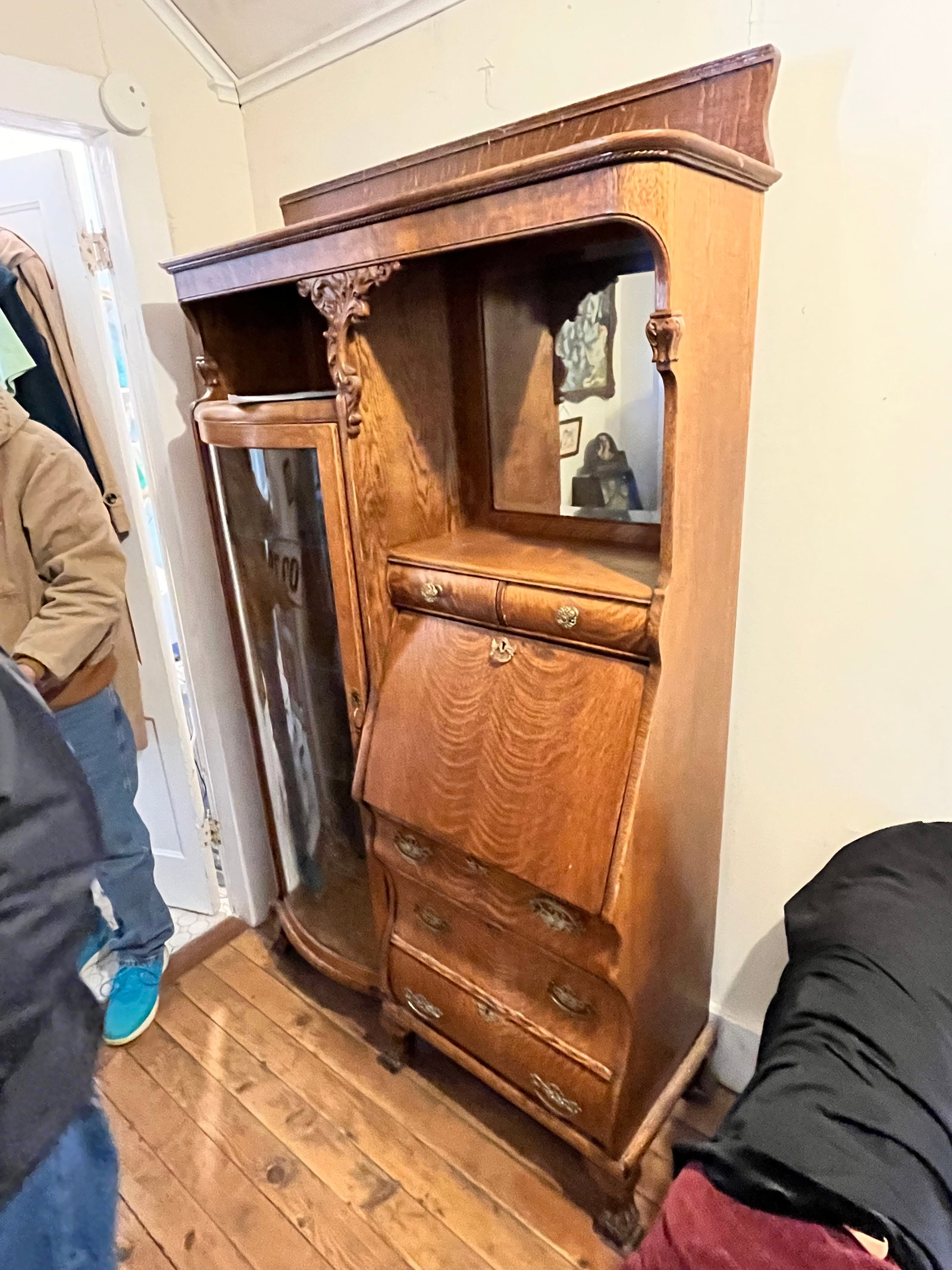 1890s American Carved Quartersawn Oak Side-by-Side: 180s American carved quartersawn oak side-by-side with four shelves and five drawers. Has bowed glass doors, beveled mirror and claw feet. 42"w x 14"d x 74.5"h. See photos. Please read the Terms and