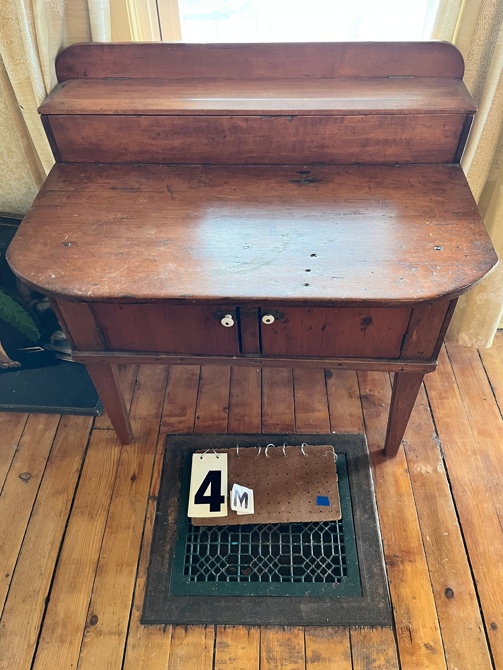 19c Hepplewhite Leg Cabinet with Lift Top and Two Doors: 19th century Hepplewhite leg cabinet with lift top and two doors. Constructed with square nails. 33"w x 21"d x 34"h. See photos. Please read the Terms and Conditions of this auction THOROUGHLY for