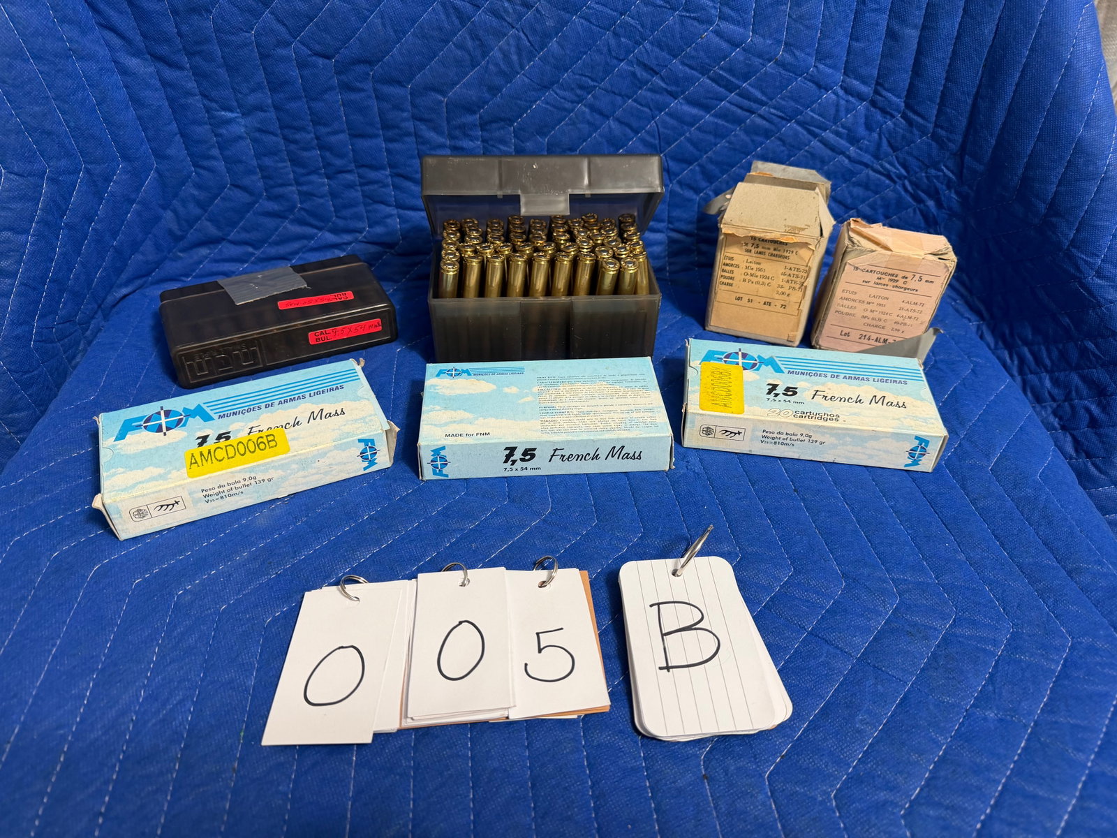 7.5x54mm Ammo: 7.5x54mm ammunition. Three blue boxes of FNM, 139 grain FMJ (60 rounds). Two white boxes of Sur Lames Chargers with 15 rounds each loaded into three stripper clips (5 rounds per clip), 30 rounds. Two